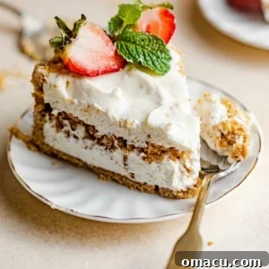 A slice of Philadelphia No-Bake Cheesecake on a plate, showing the creamy filling and distinct layers.