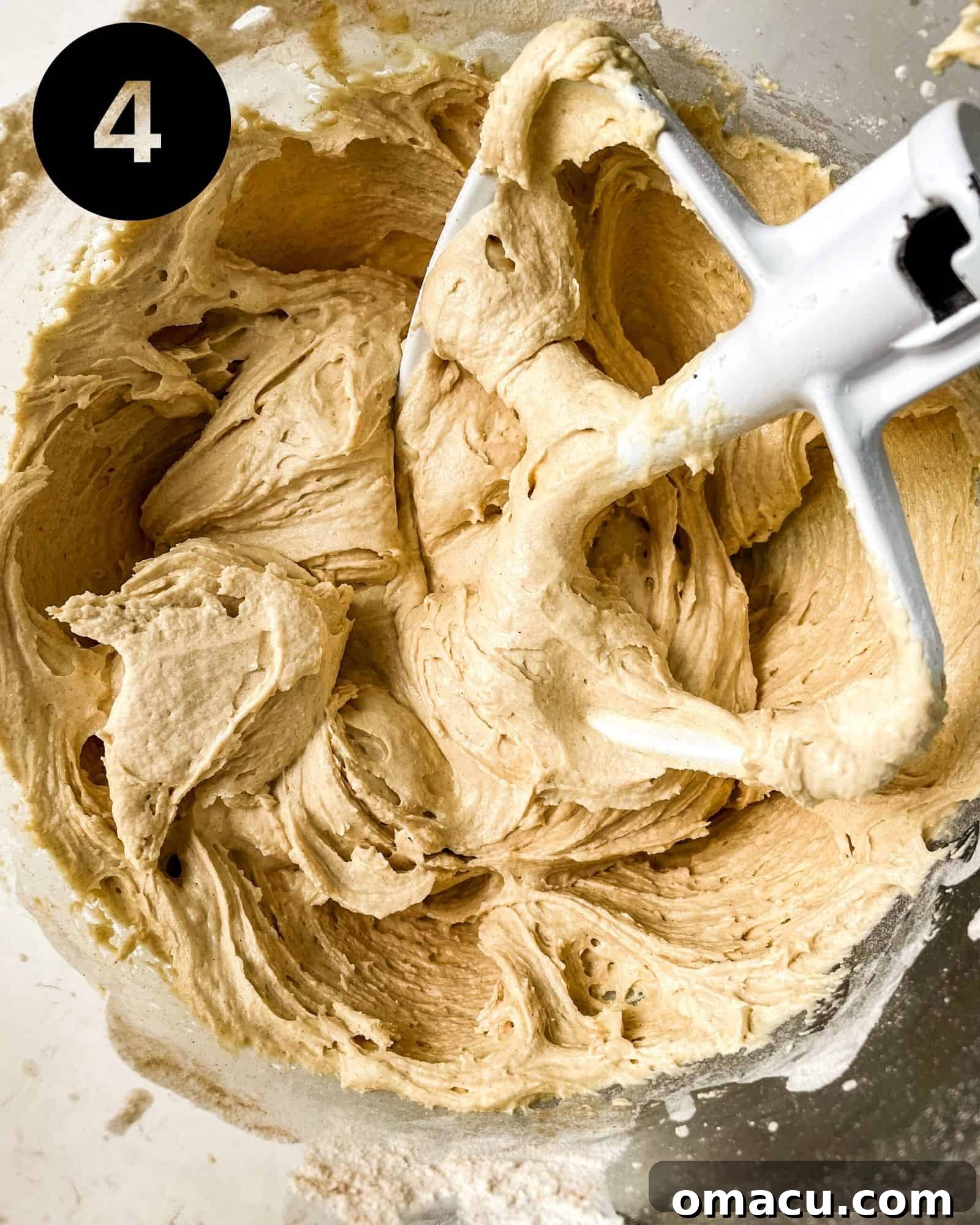 Smooth and fluffy maple buttercream in a mixing bowl, ready for frosting.