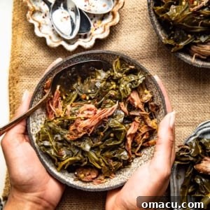slow cooker collard greens in a bowl with a spoon.