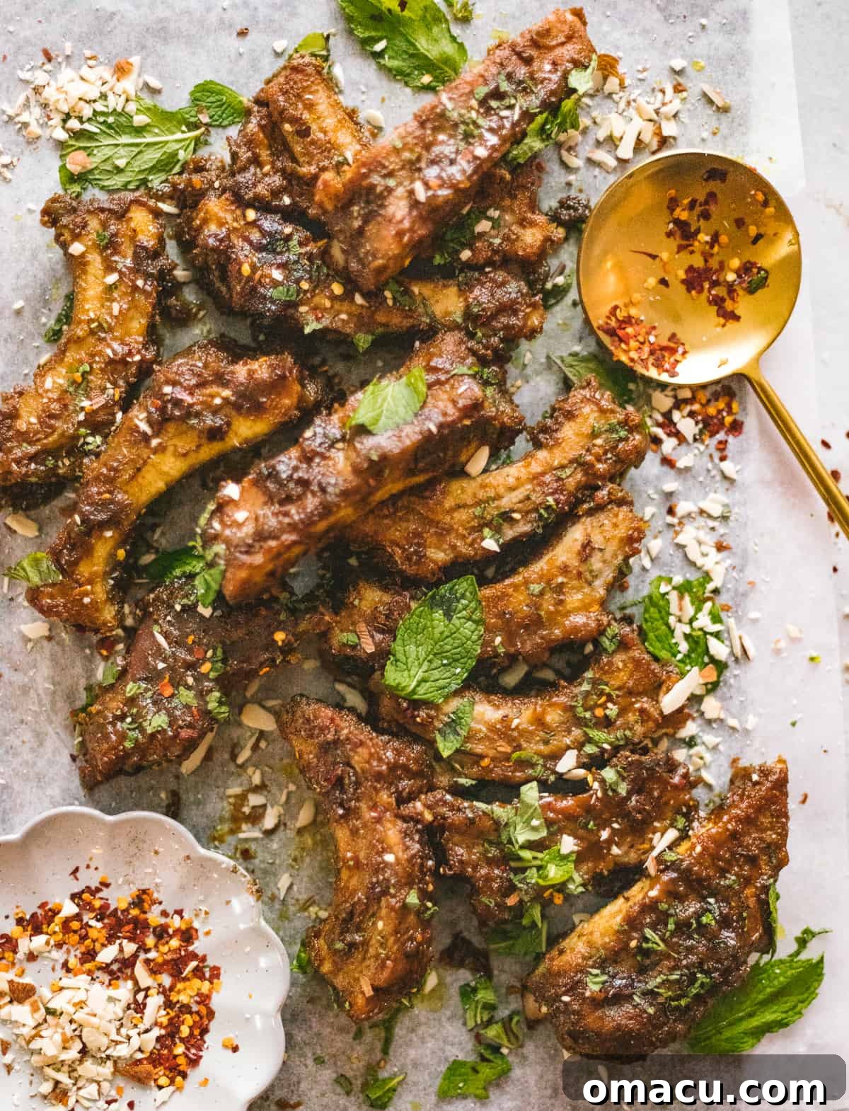 Delectable peanut curry braised ribs, perfectly cooked and glistening with their rich, flavorful sauce, promising an exotic and tender culinary experience.