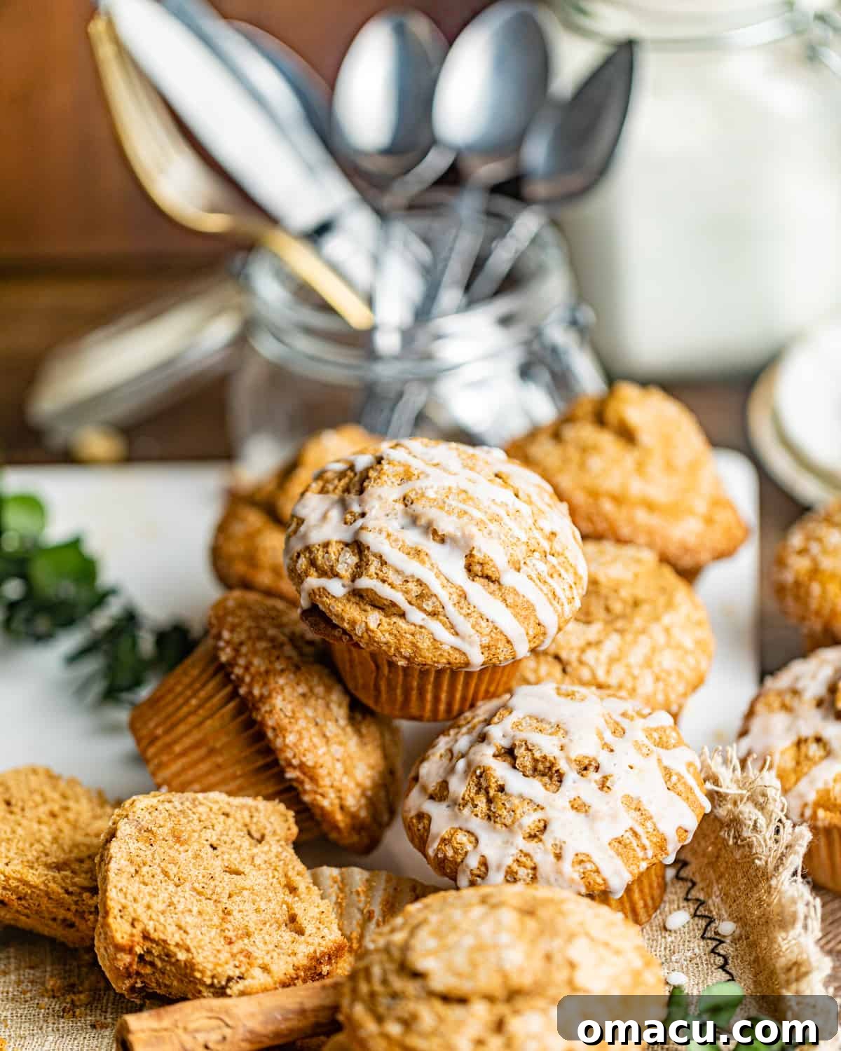 A delectable pile of gingerbread muffins, artfully stacked on top of each other on a elegant serving board, ready to be enjoyed as a festive treat.