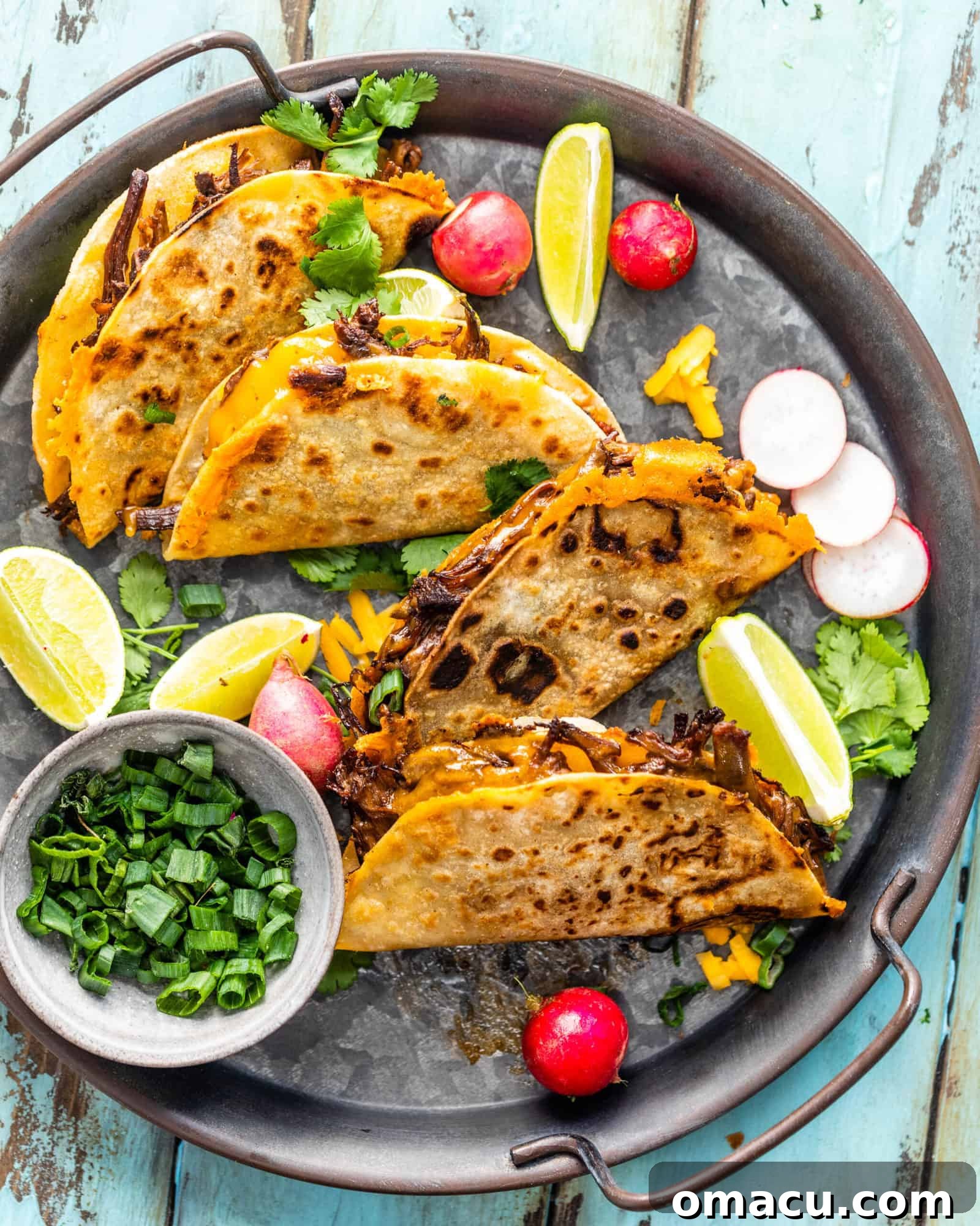 tacos spread out on a serving tray