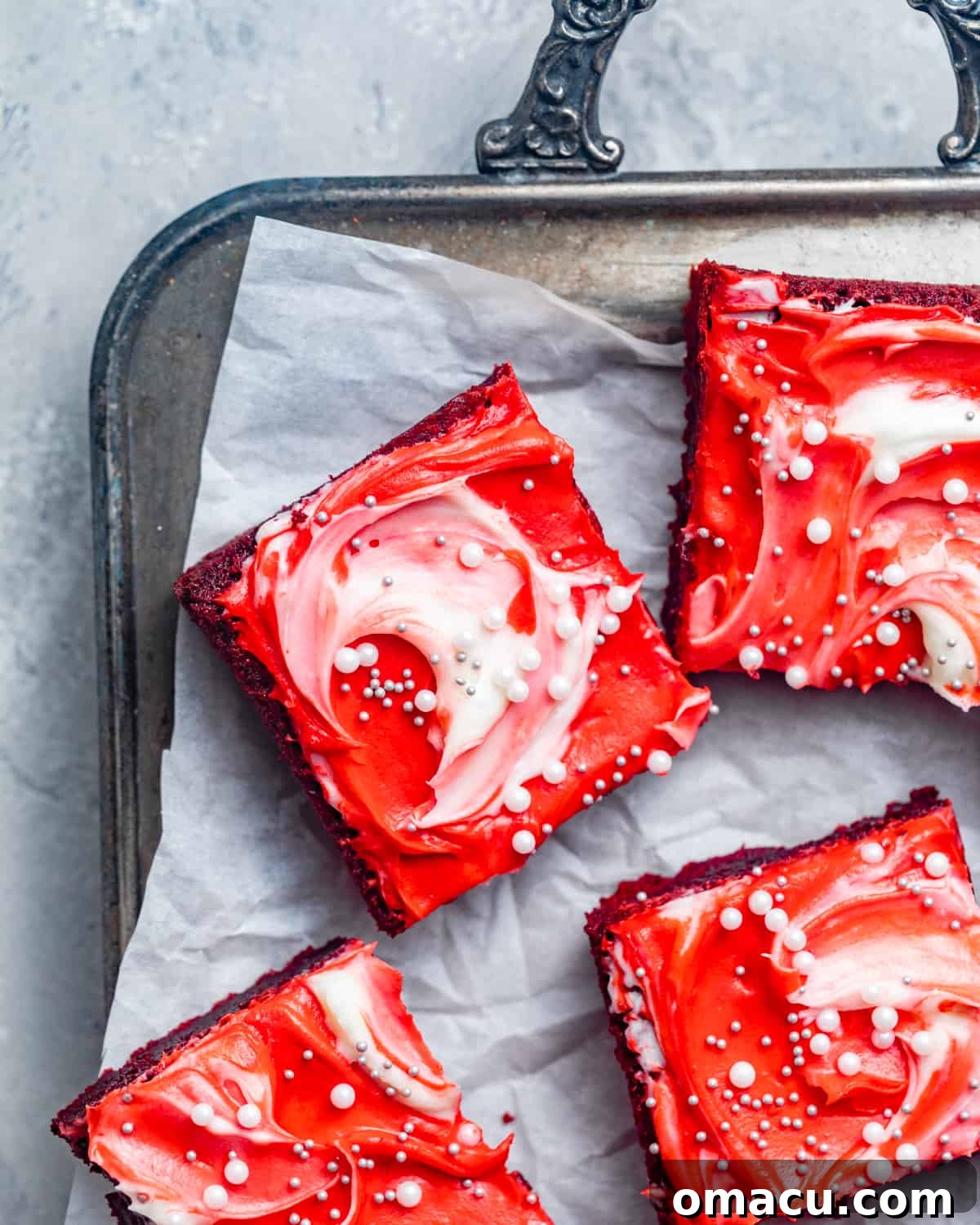 Red velvet brownies beautifully arranged on a serving platter, expertly cut into uniform squares, ready to be enjoyed.