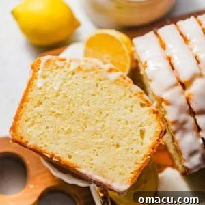 a slice of a lemon cake on top of a tea cup.