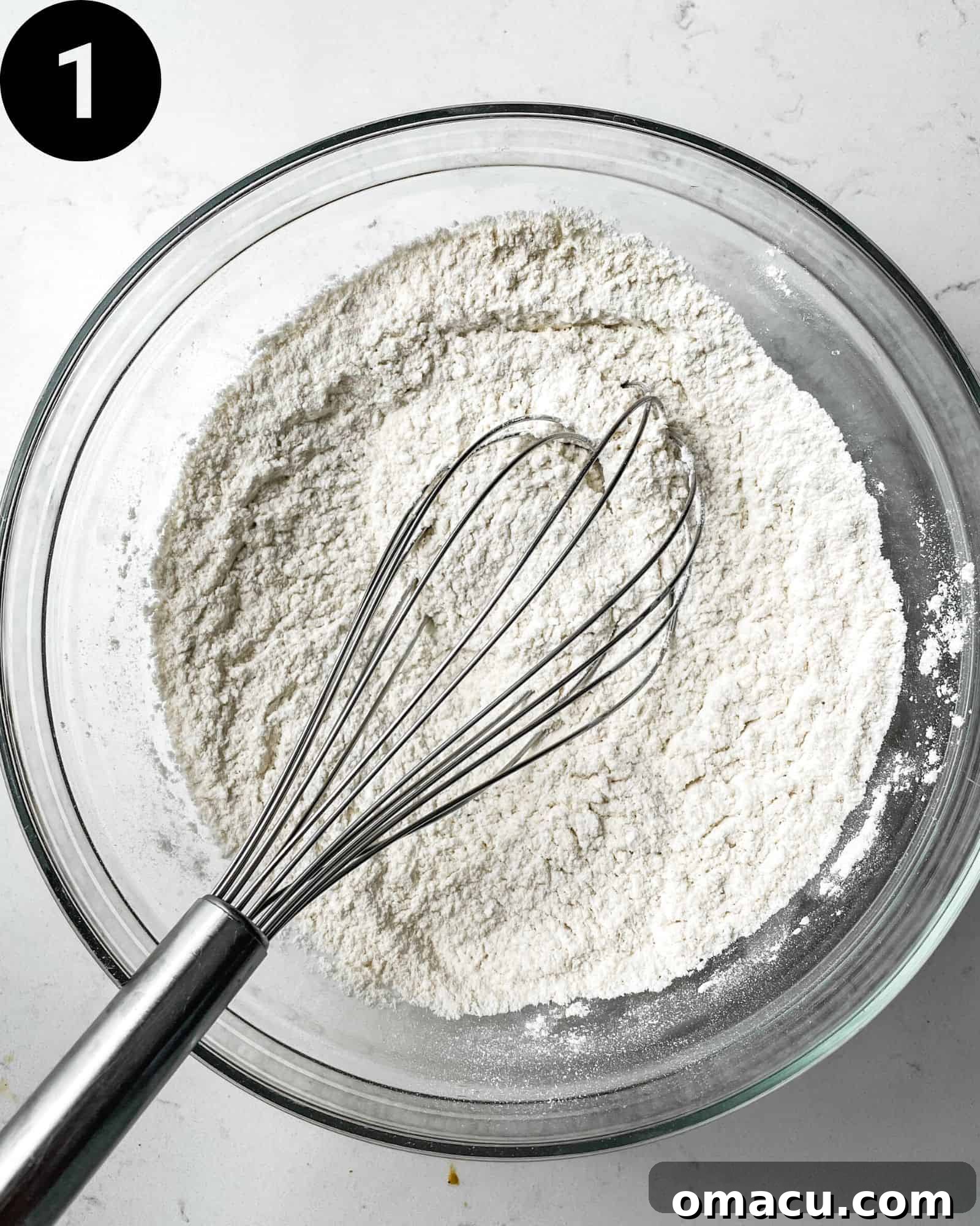 dry ingredients whisked together in a bowl - flour, cornstarch, baking powder, ground ginger, and kosher salt.
