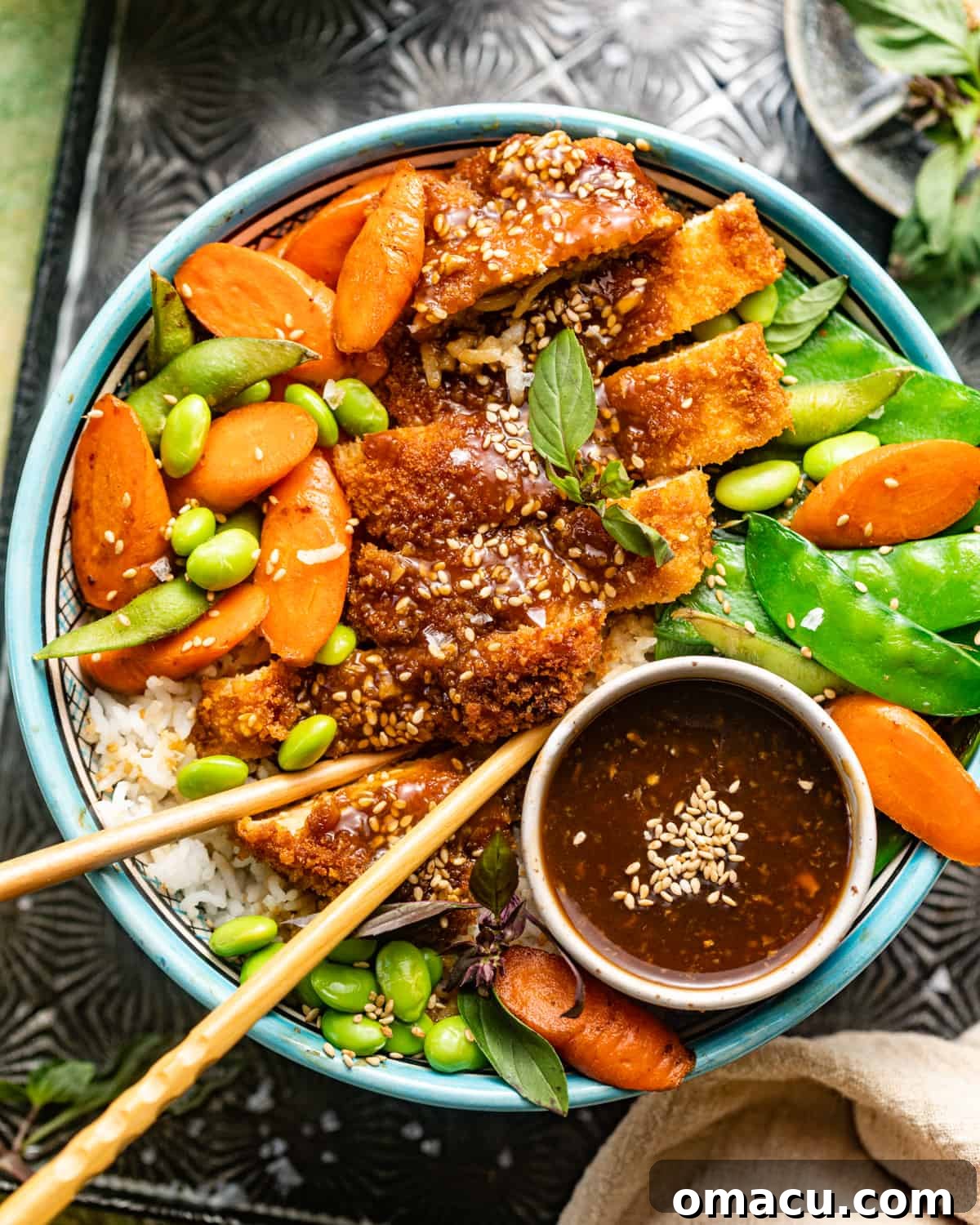 Teriyaki chicken bowls presented beautifully on a platter with chopsticks, ready to be served.