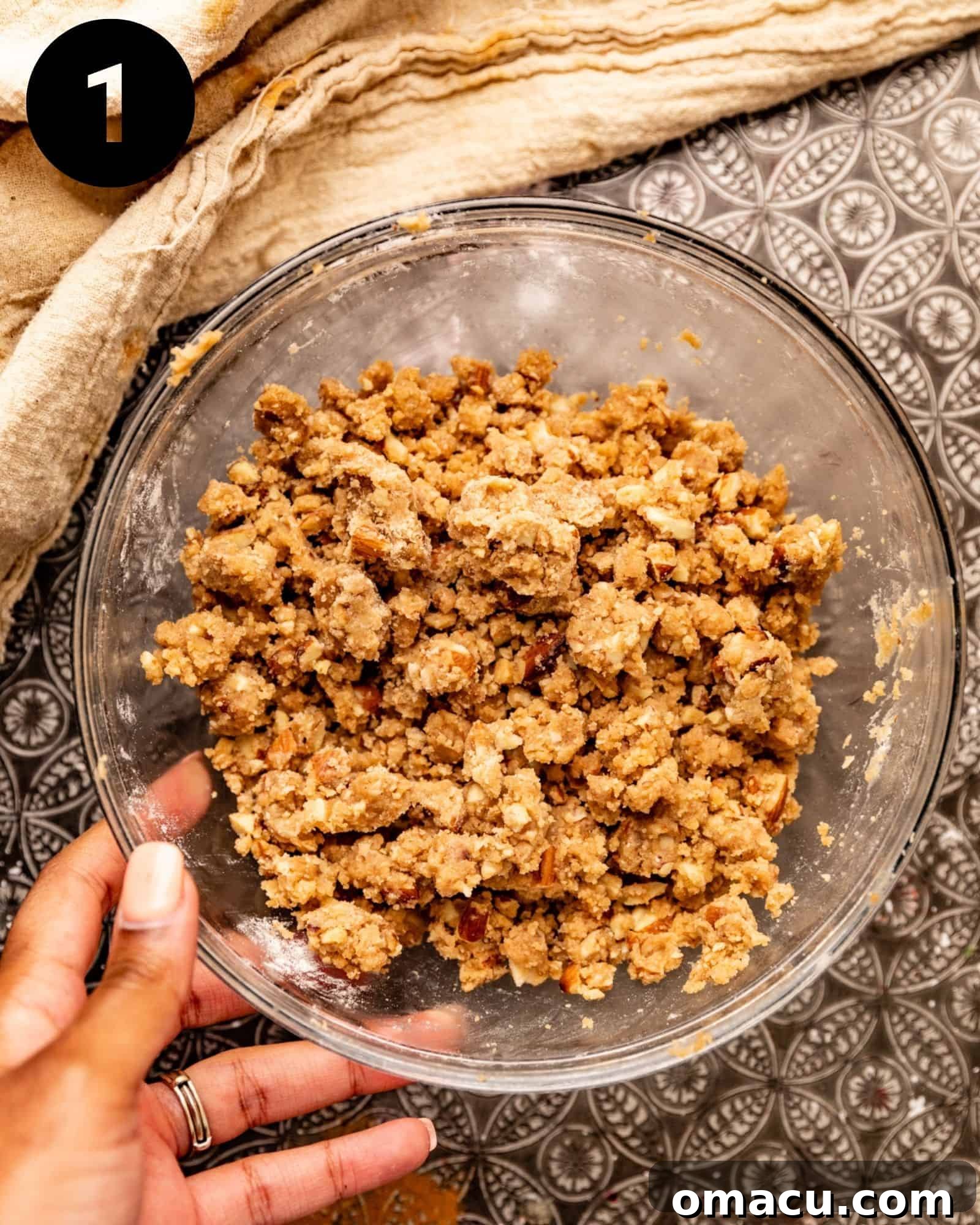 Crumble topping mixture in a bowl, showing the crumbly texture before baking.