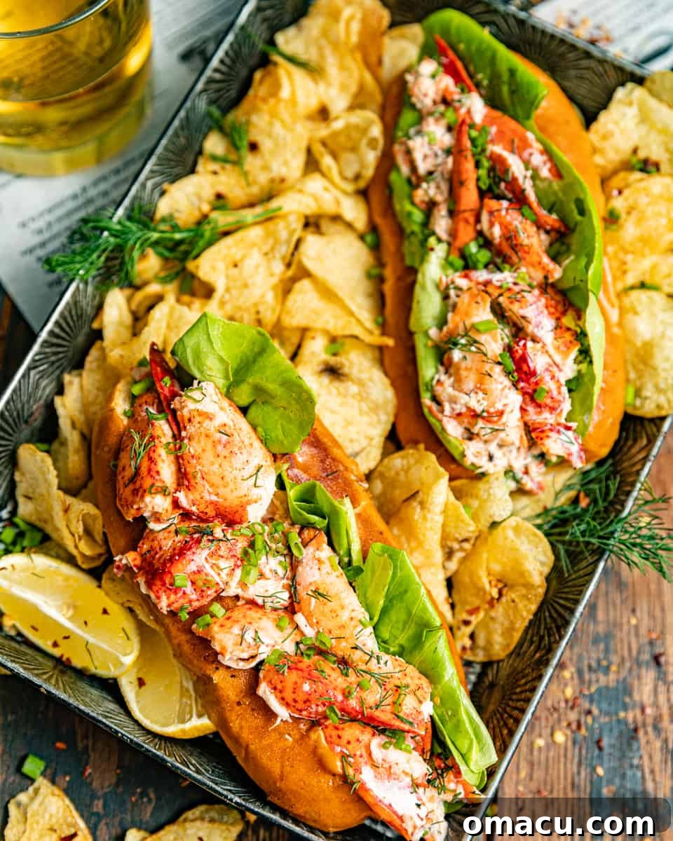 A close-up of a New England lobster roll on a serving tray next to a glass of soda, showcasing the rich lobster filling and toasted bun.