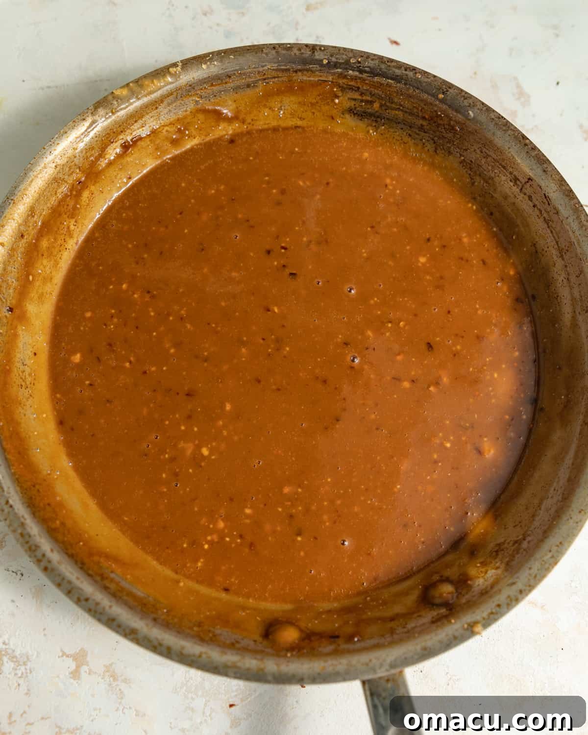 Spicy peanut sauce in a saucepan.