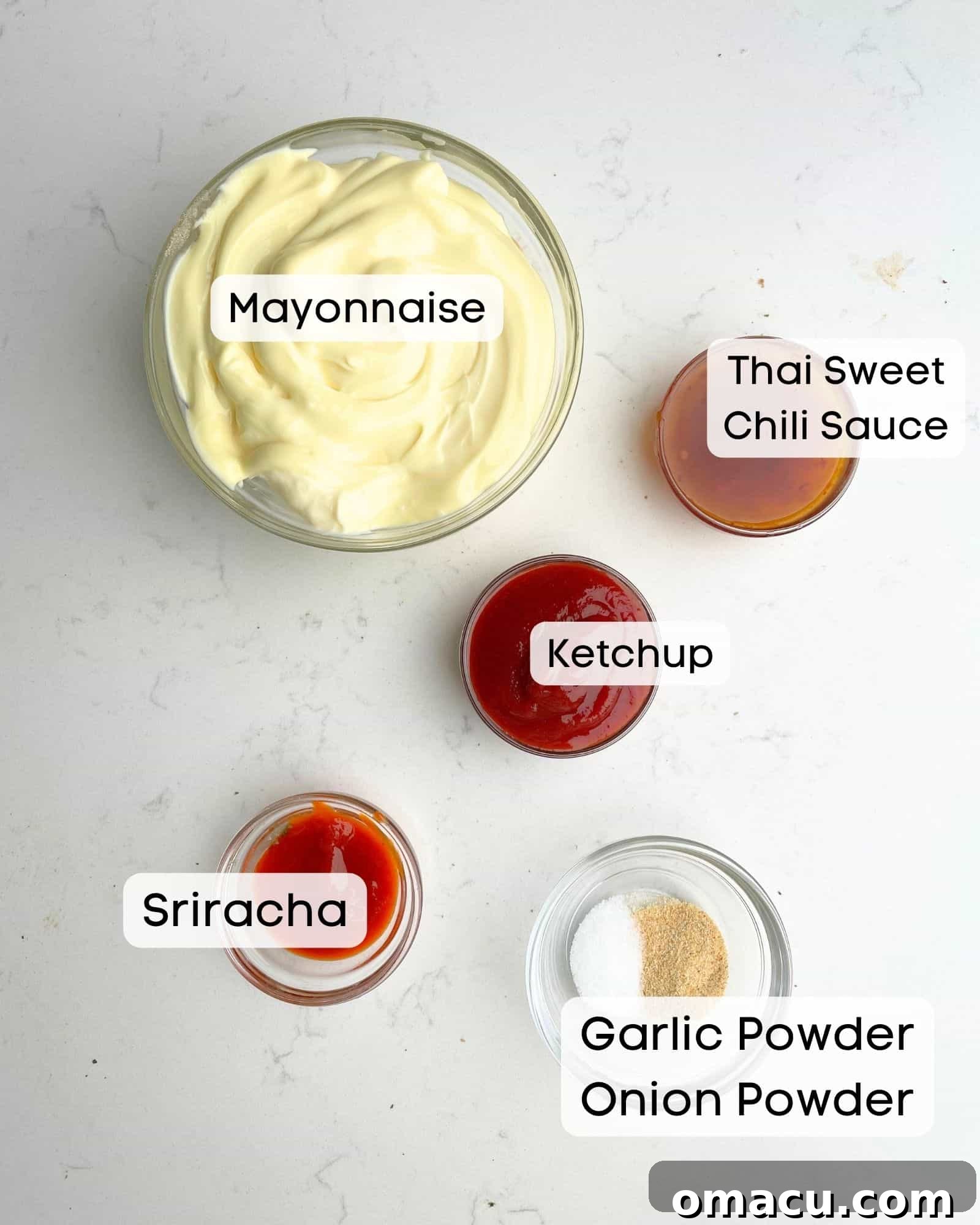 Boom Boom Sauce ingredients laid out: mayonnaise, Thai sweet chili sauce, sriracha, ketchup, garlic powder, and onion powder.