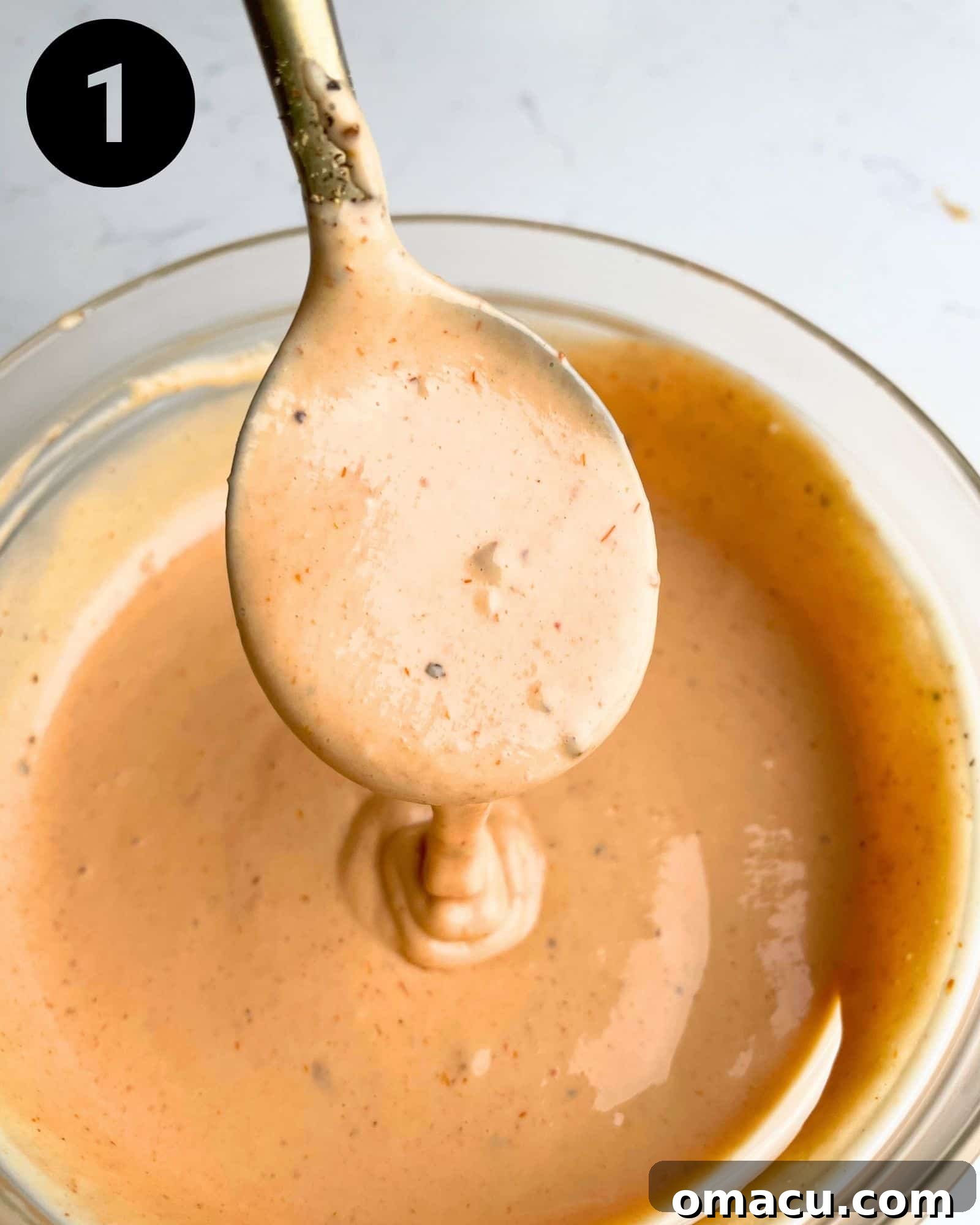 Boom Boom Sauce mixed together smoothly in a bowl with a spoon, ready to be served.