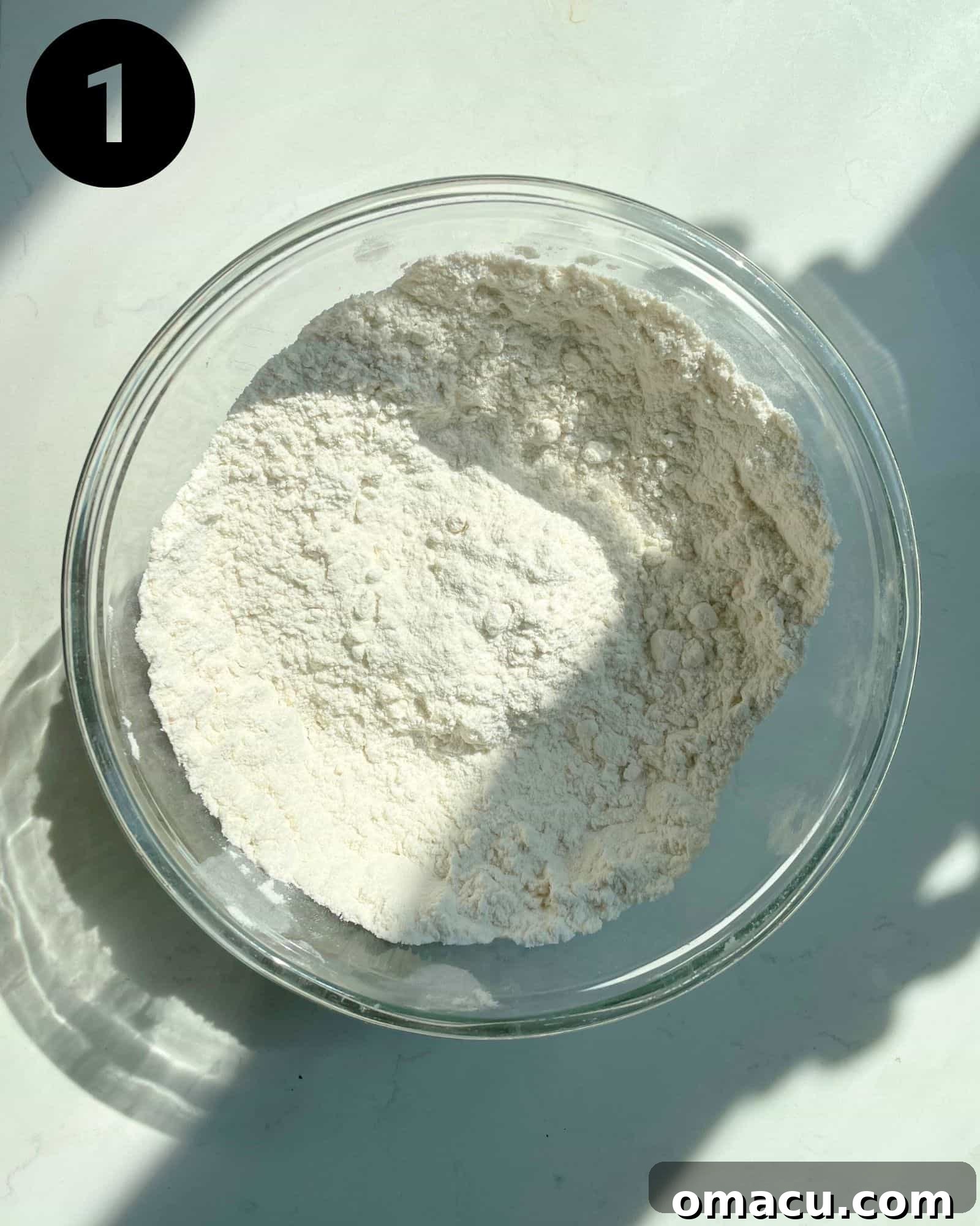 A bowl of dry ingredients for the cake, perfectly whisked and ready.
