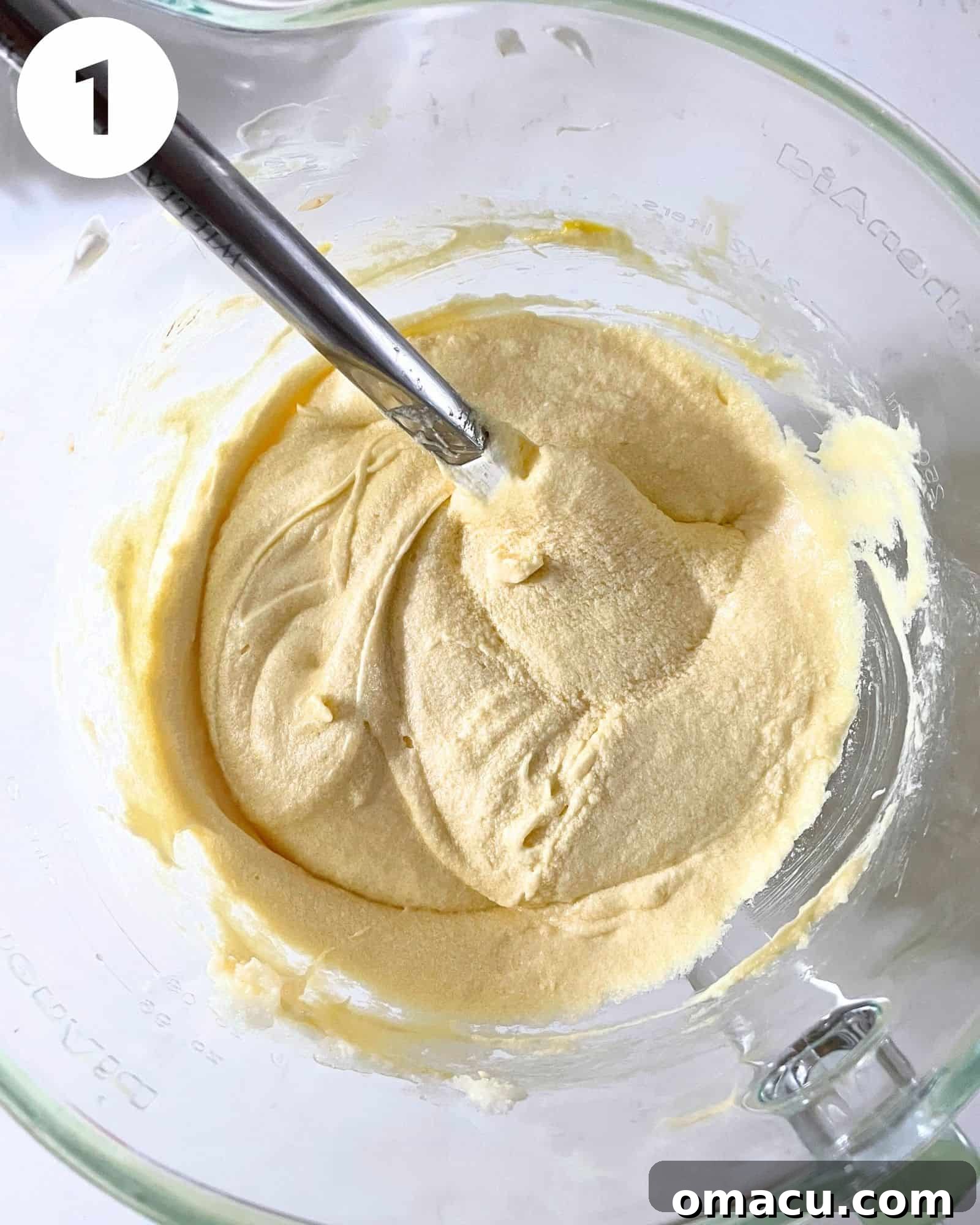 Creamed butter, shortening, and sugar mixture in a stand mixer bowl, showing a light and fluffy texture.