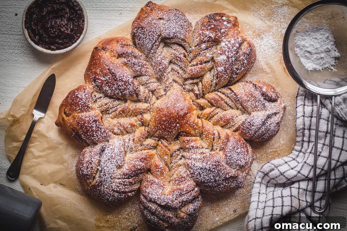 Close-up of baked prune starbread showing the layers of dough and prune filling.