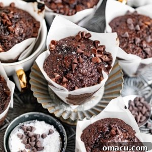 Fudgy brownie muffins on a silver tray with flake salt and mini chocolate chips, ready to be served.