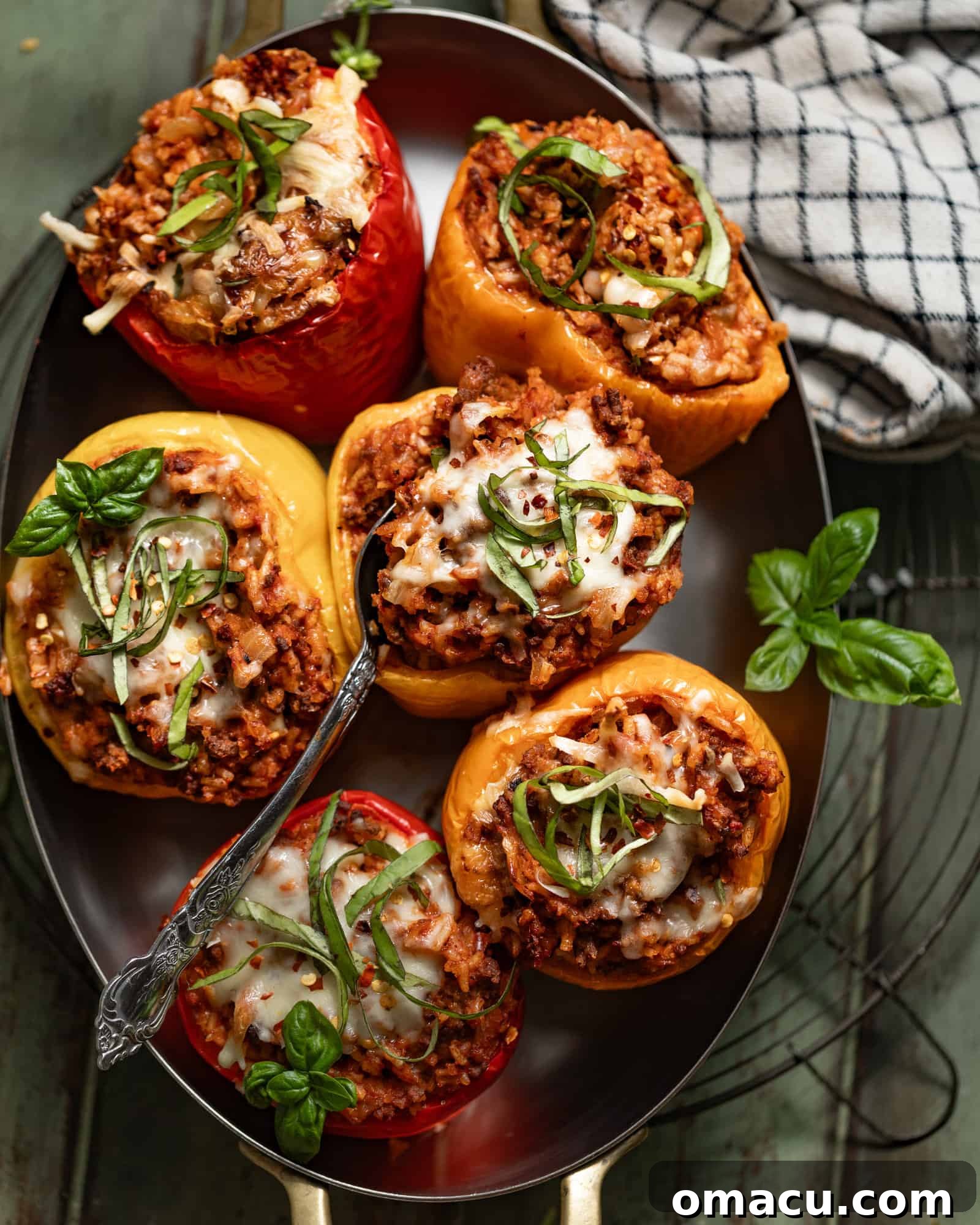 Beef stuffed peppers in a baking dish, ready to be served.