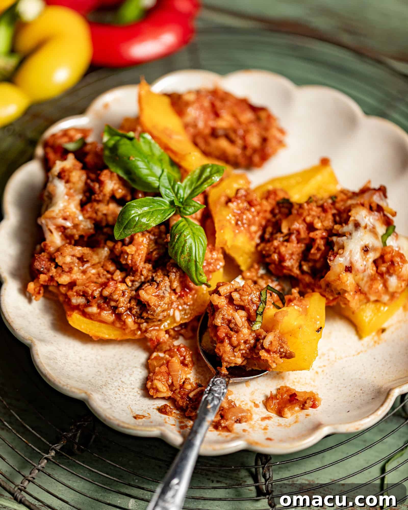 A beef stuffed pepper, cut in half, showcasing the flavorful filling on a plate.