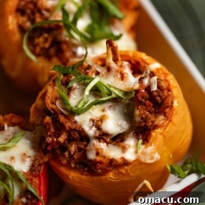 Beef stuffed peppers in a baking dish, ready to serve.