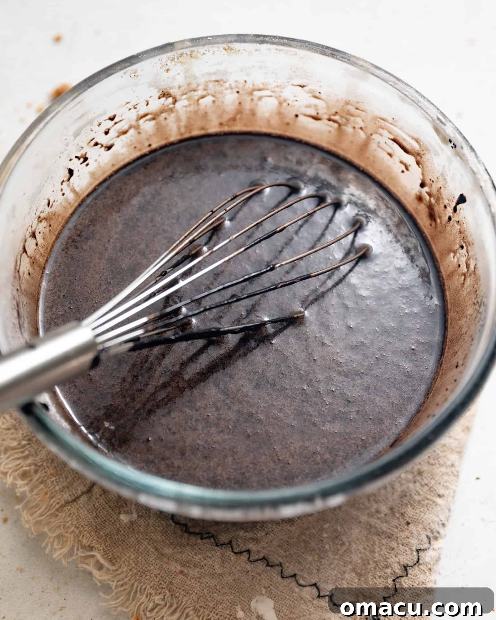Cupcake batter in a mixing bowl, ready to be poured.