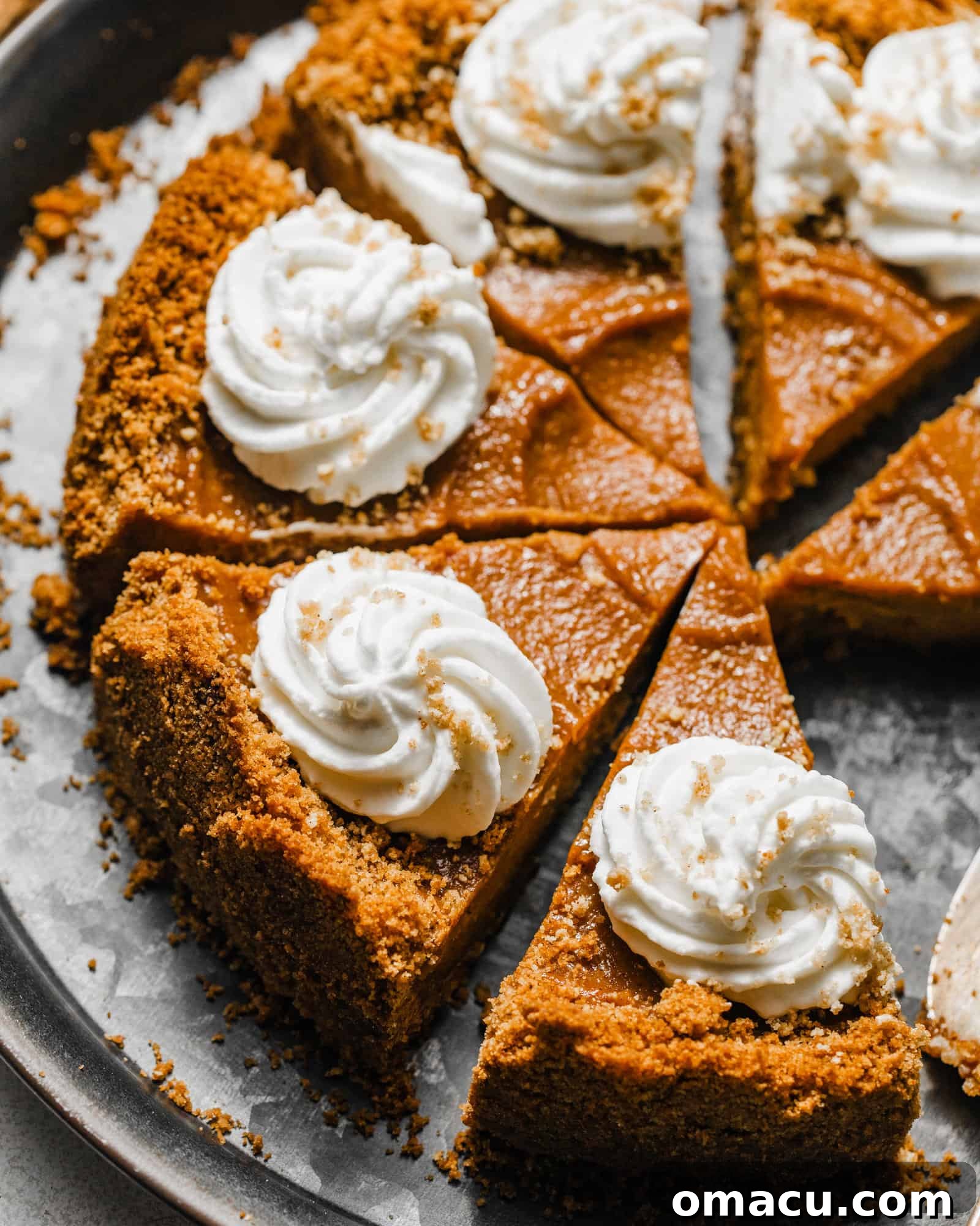 sweet potato pie with graham cracker crust on a silver tray