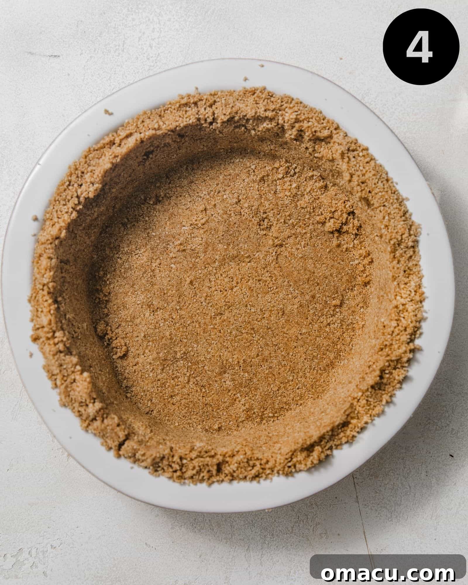 graham cracker crust in a pie pan