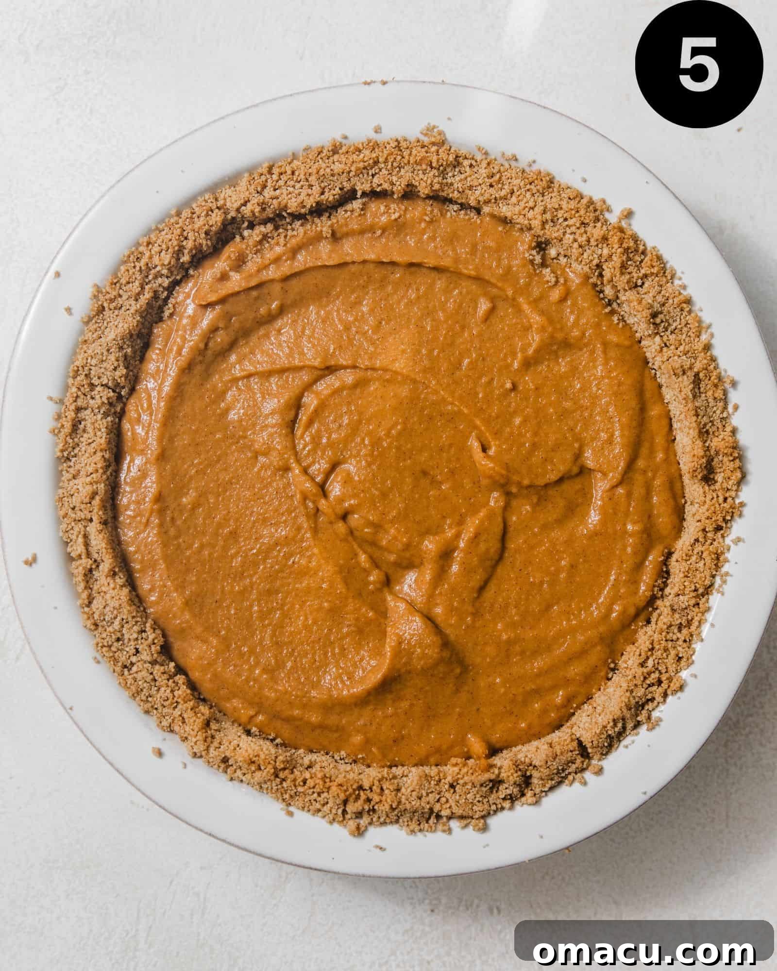 sweet potato pie in a glass pie pan