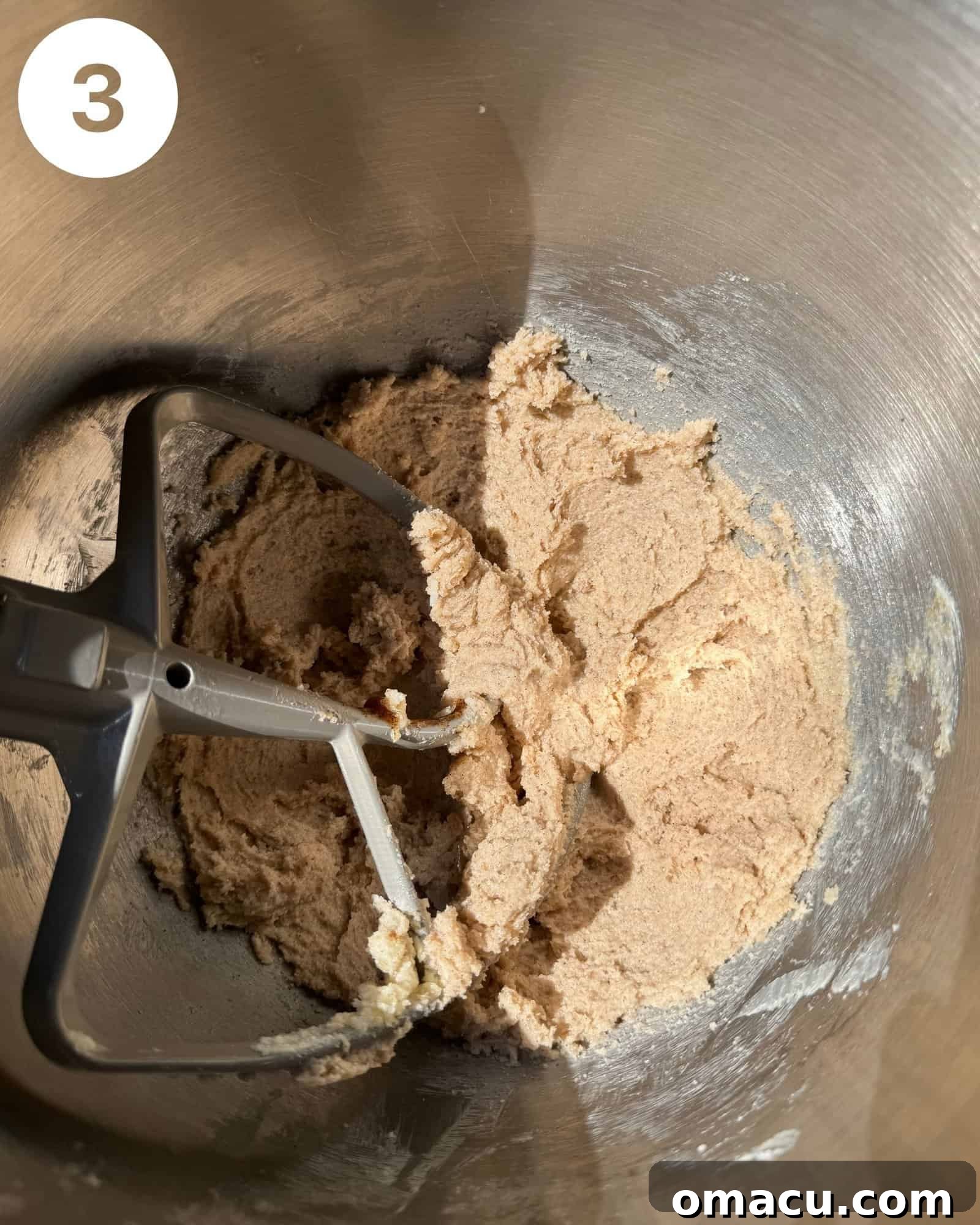 Smooth and creamy sugar cookie dough in the bowl of a stand mixer, ready for the dry ingredients