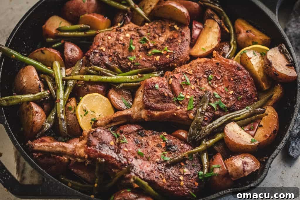 Individual Honey Soy Garlic Pork Chop served with green beans and roasted potatoes.