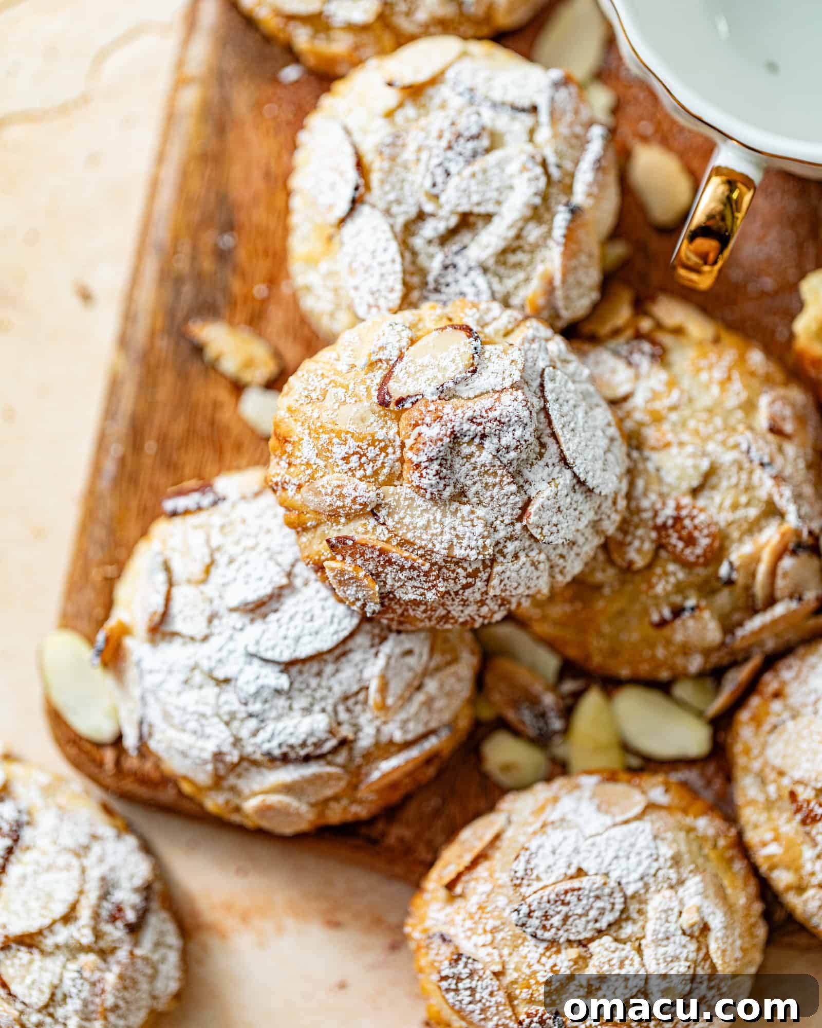 almond croissant cookies on a cutting board.