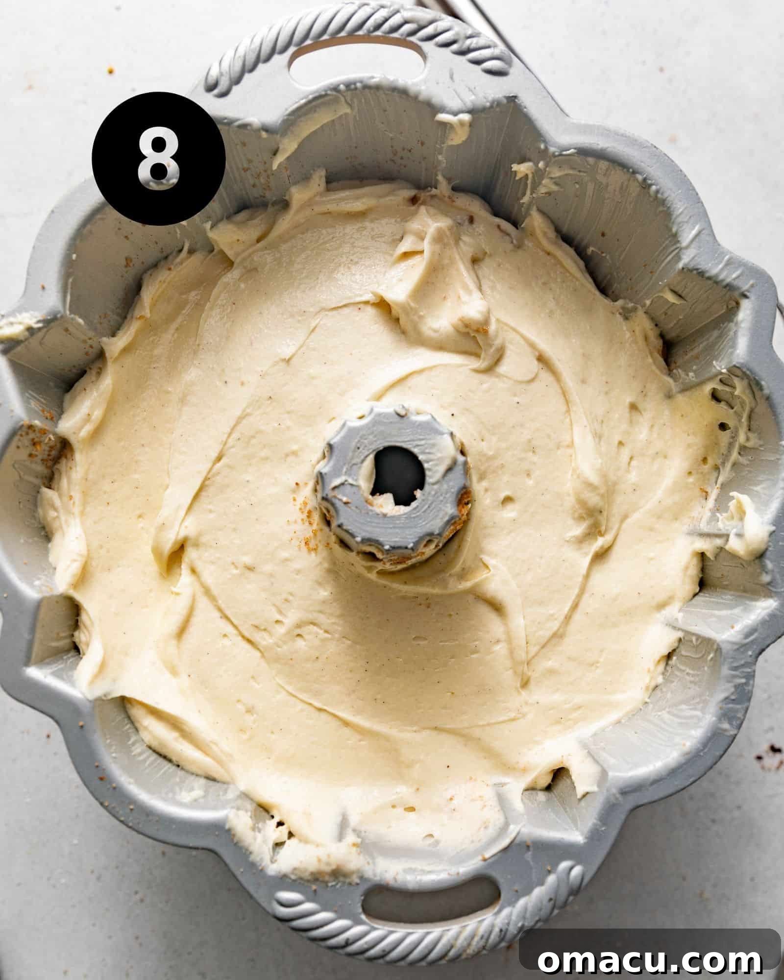 The Sock it to Me Cake batter, now fully assembled with its streusel filling, resting in the bundt pan, ready for the oven.
