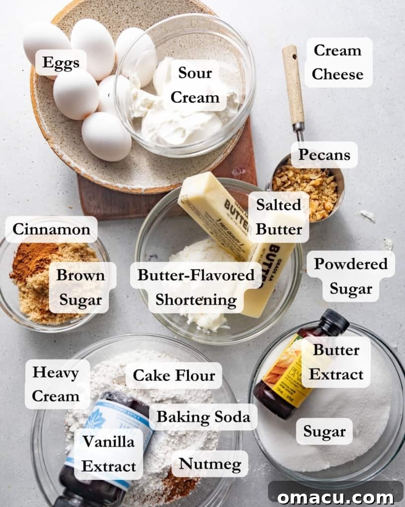 A vibrant flat lay of all the essential ingredients needed to bake Sock it to Me Cake from scratch, including eggs, butter, shortening, cinnamon, nutmeg, pecans, cream cheese, sugar, brown sugar, baking soda, cake flour, kosher salt, heavy cream, and sour cream.