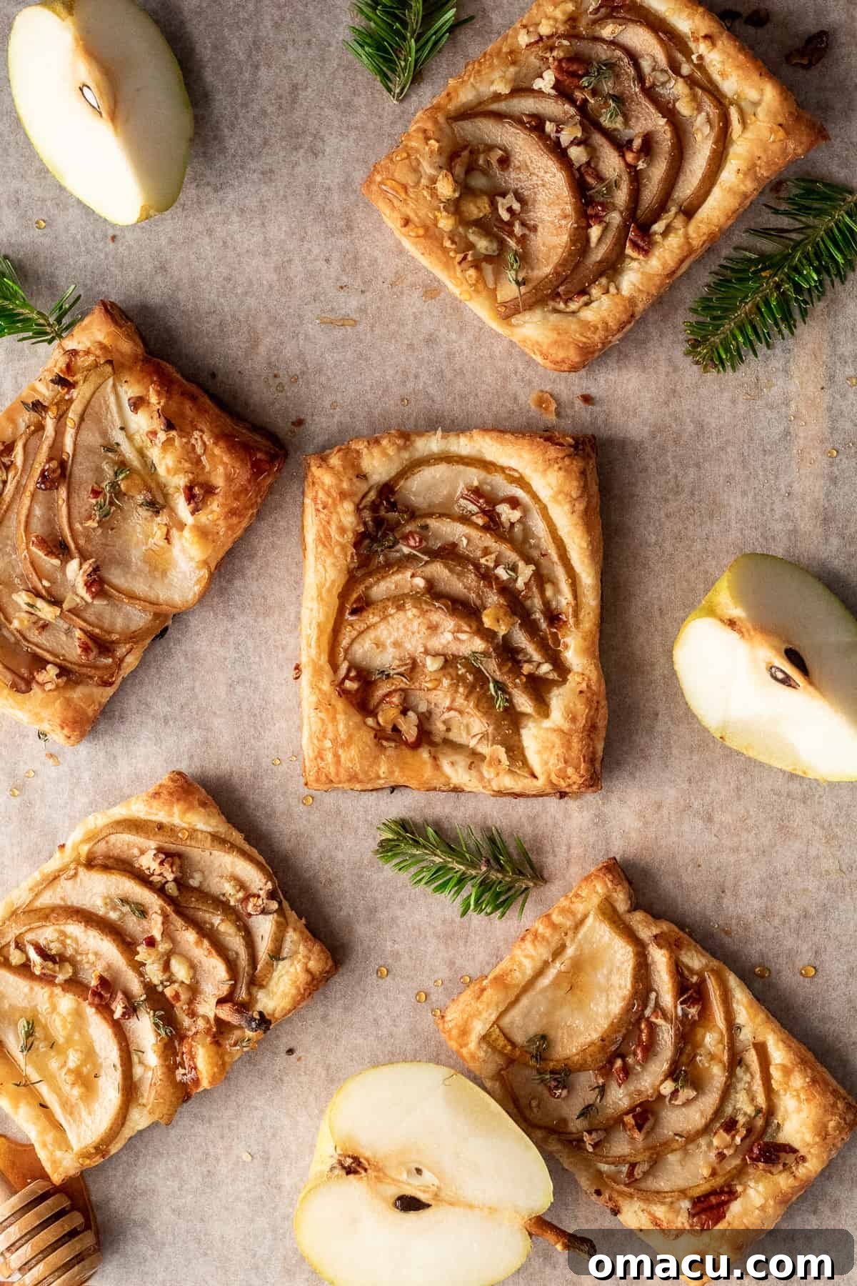Freshly baked pear and gorgonzola puff pastry on a cooling rack, showcasing the perfect golden color and inviting textures.