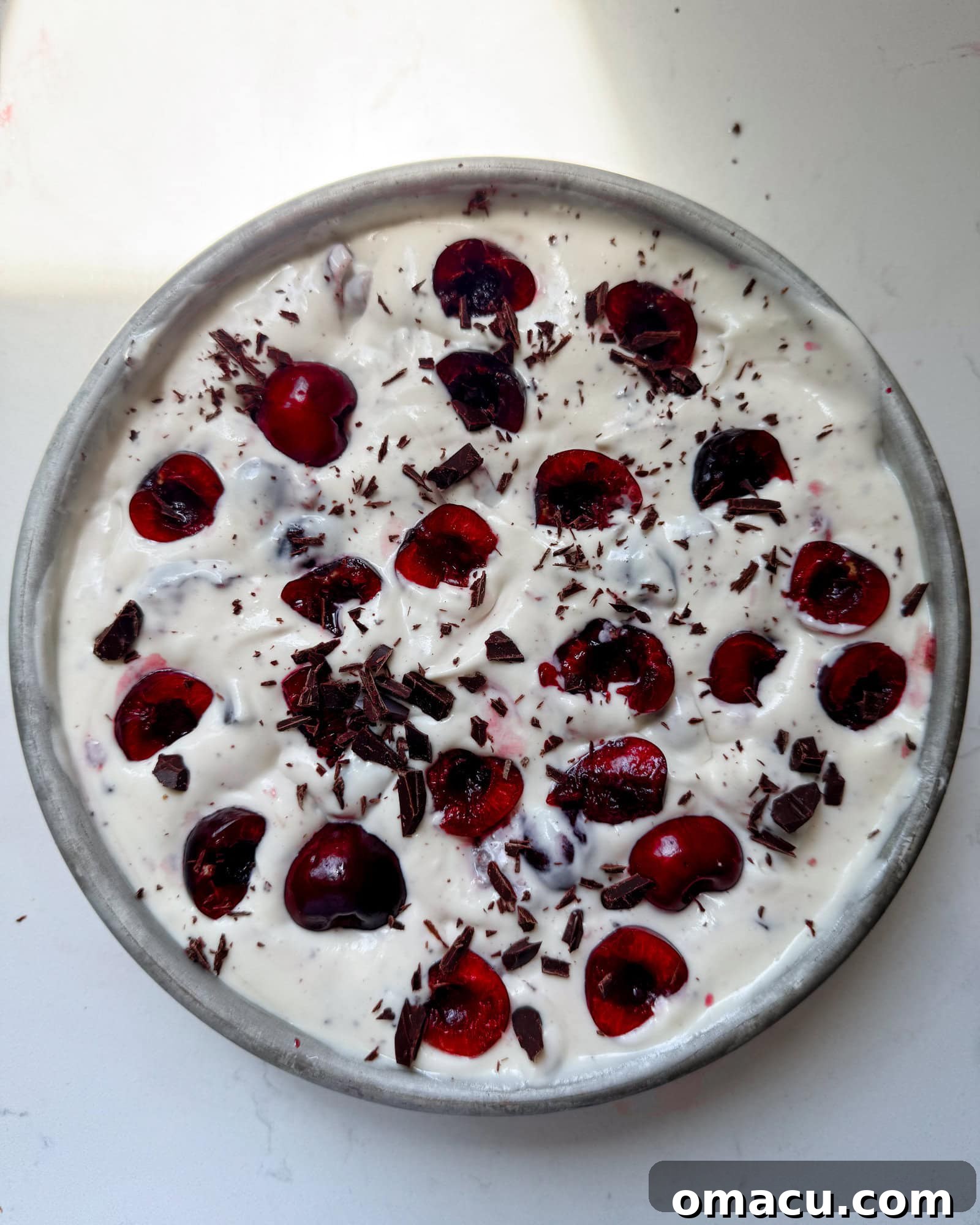Black cherry ice cream in a round container.
