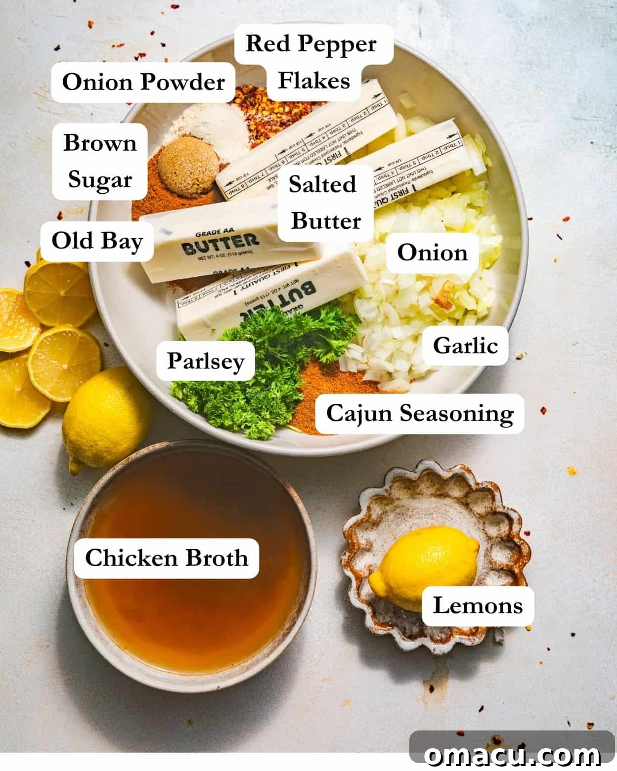 Ingredients for garlic butter sauce: butter, onion, garlic, Cajun seasoning, Old Bay seasoning, chicken broth, parsley, brown sugar, and lemons.