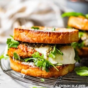 A close-up of a delectable chicken parmesan sandwich, perfectly assembled and ready to be enjoyed.