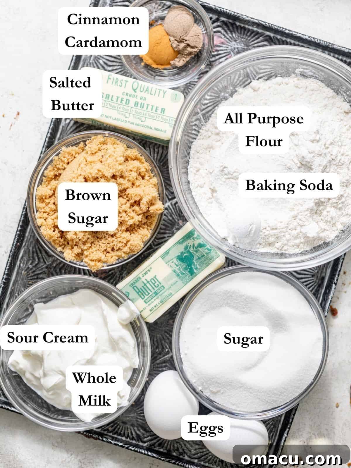 cardamom coffee cake ingredients on a baking sheet.