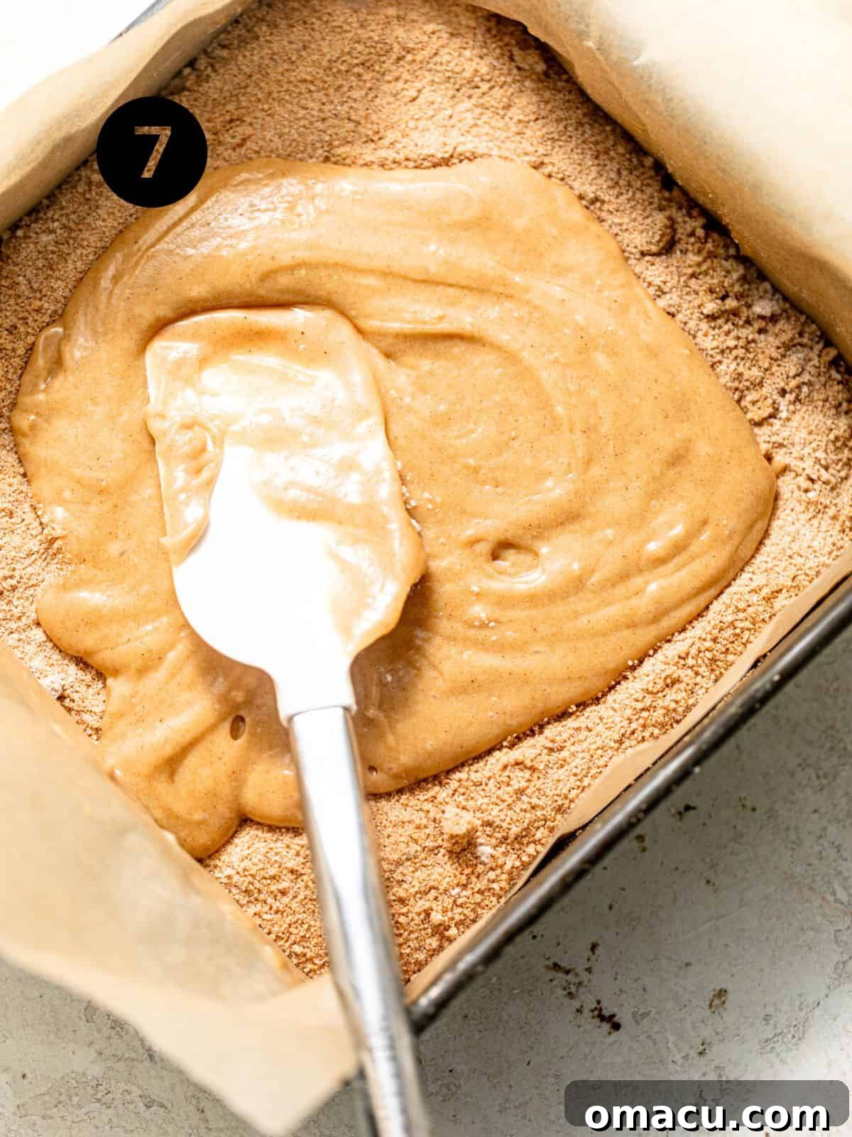 cake batter in the pan with the filling sprinkled onto the middle.