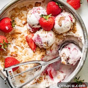 strawberry shortcake ice cream with fresh strawberries on top.