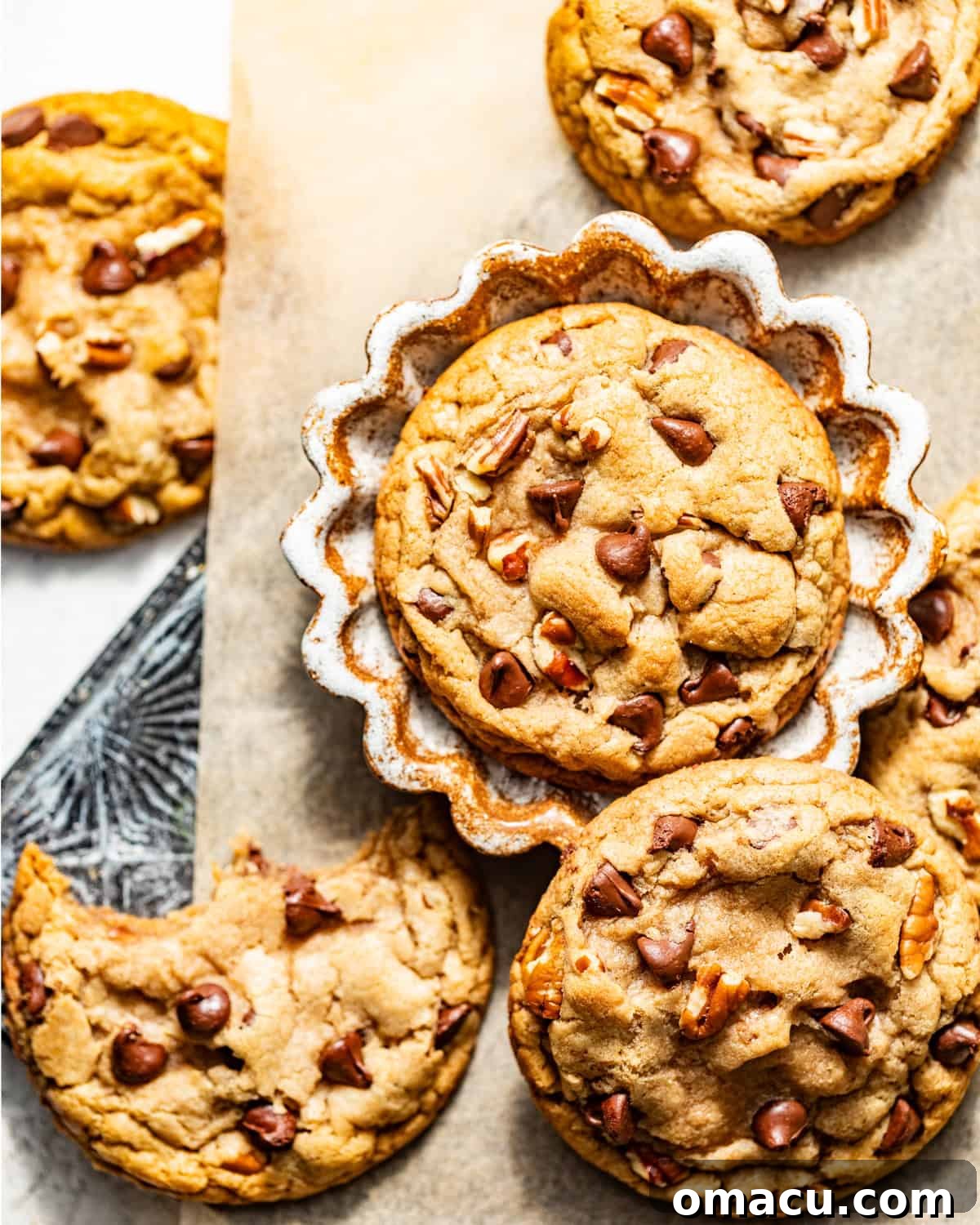 Soft and chewy banana chocolate chip cookies arranged neatly on a serving tray, showcasing their golden-brown edges and melted chocolate chips.