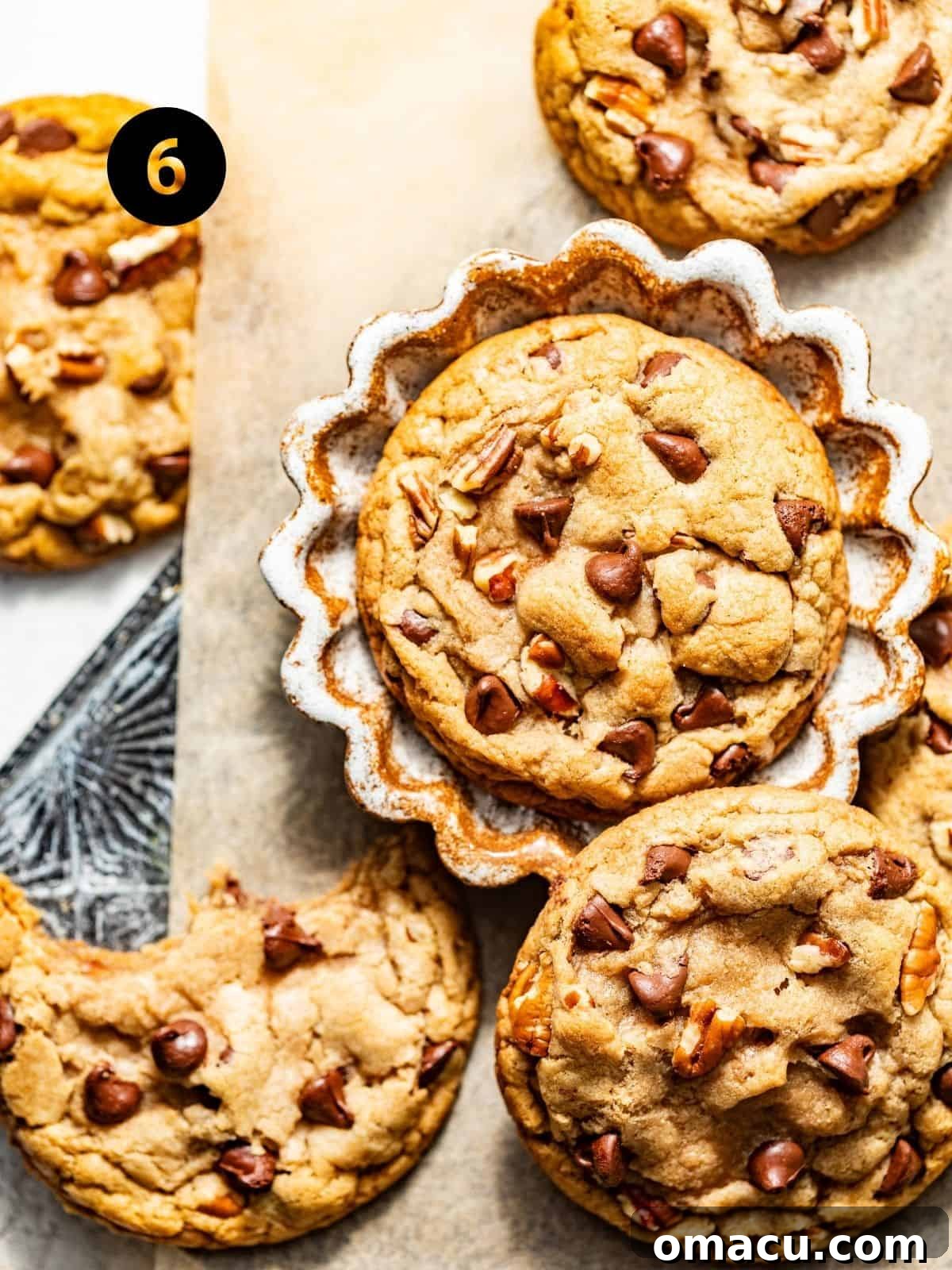 Warm banana chocolate chip cookies cooling on a wire rack after being freshly baked, perfectly round and delicious.