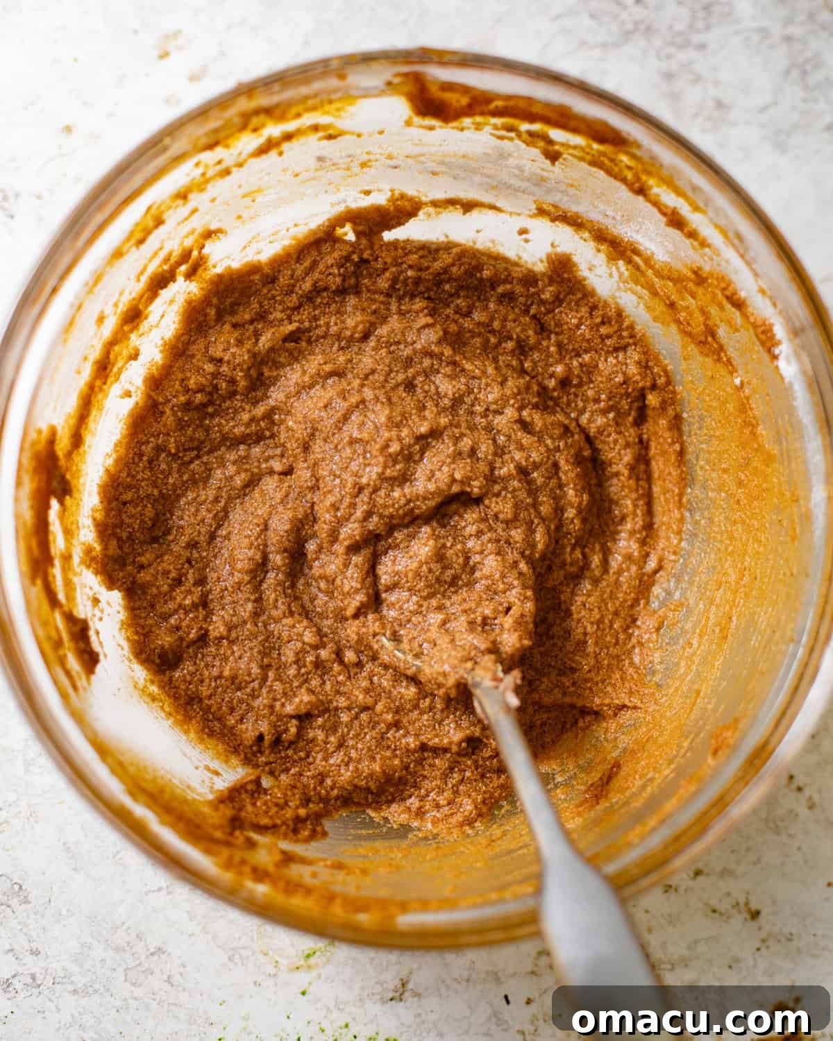 Prepared pumpkin butter cinnamon filling in a bowl, ready to be spread onto the dough.