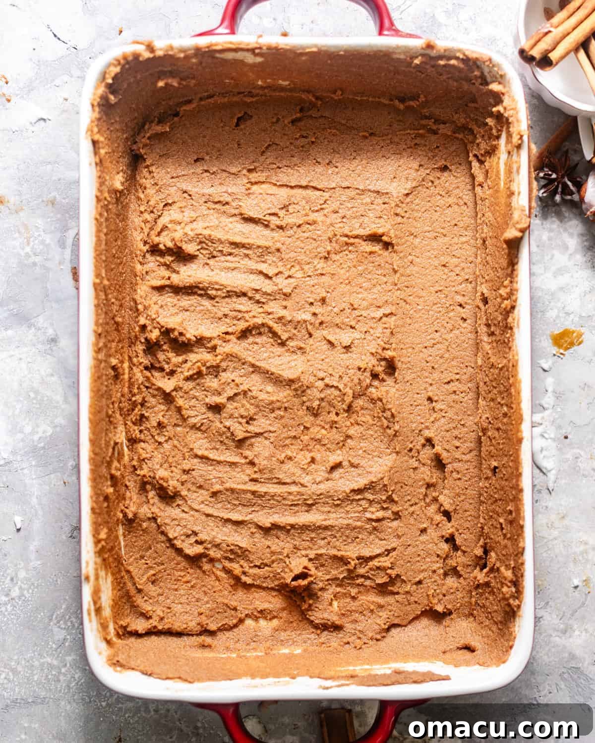 A 9x13 inch baking dish coated with the rich pan sauce.