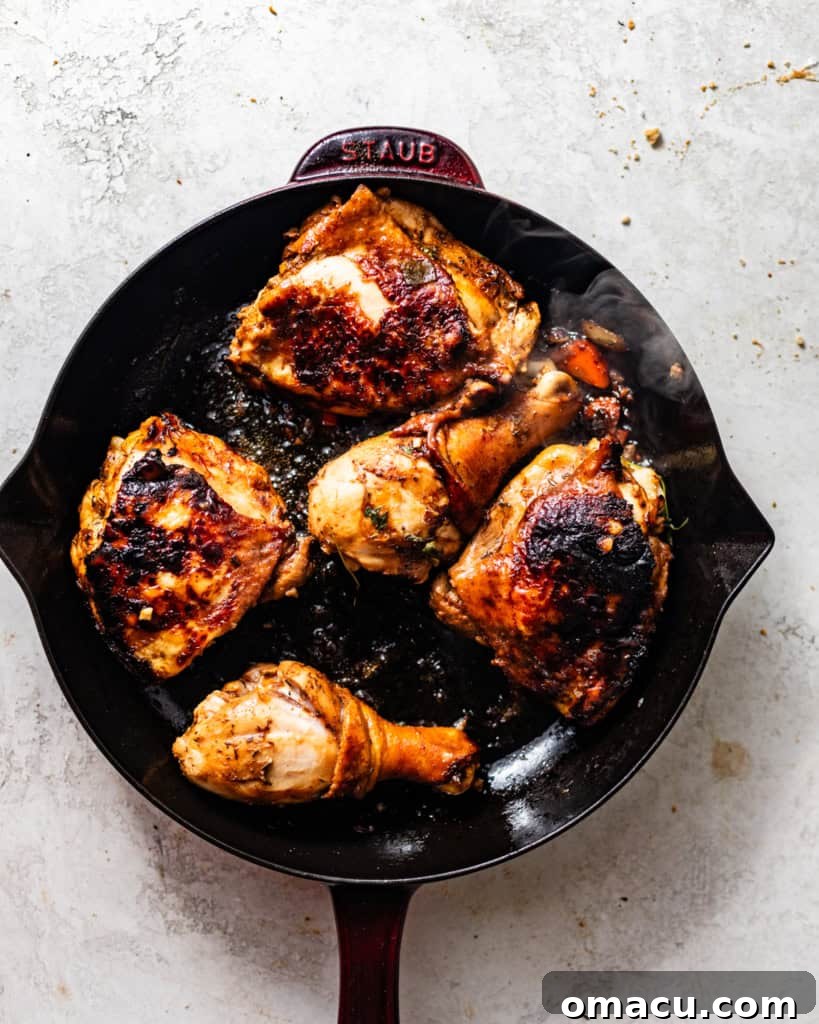 Perfectly seared chicken pieces achieving a beautiful golden-brown crust in a hot skillet, signaling the development of rich flavor.