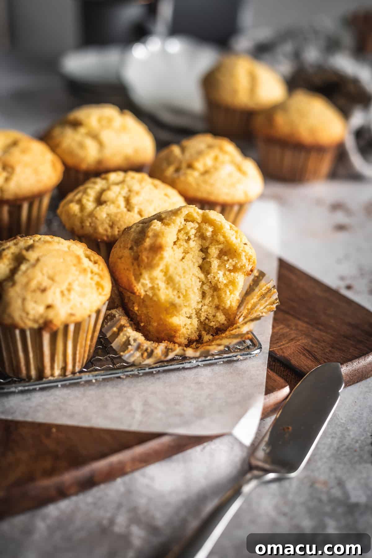 Close-up of fluffy corn muffins with cinnamon maple butter drizzle