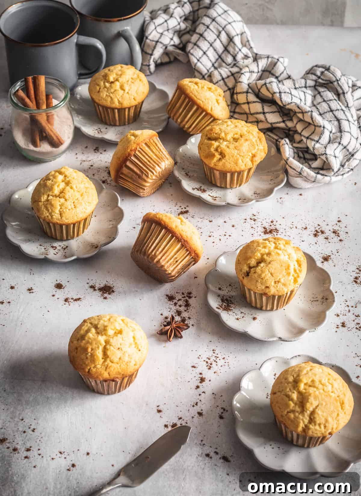 A beautifully presented corn muffin on a plate with melted cinnamon maple butter