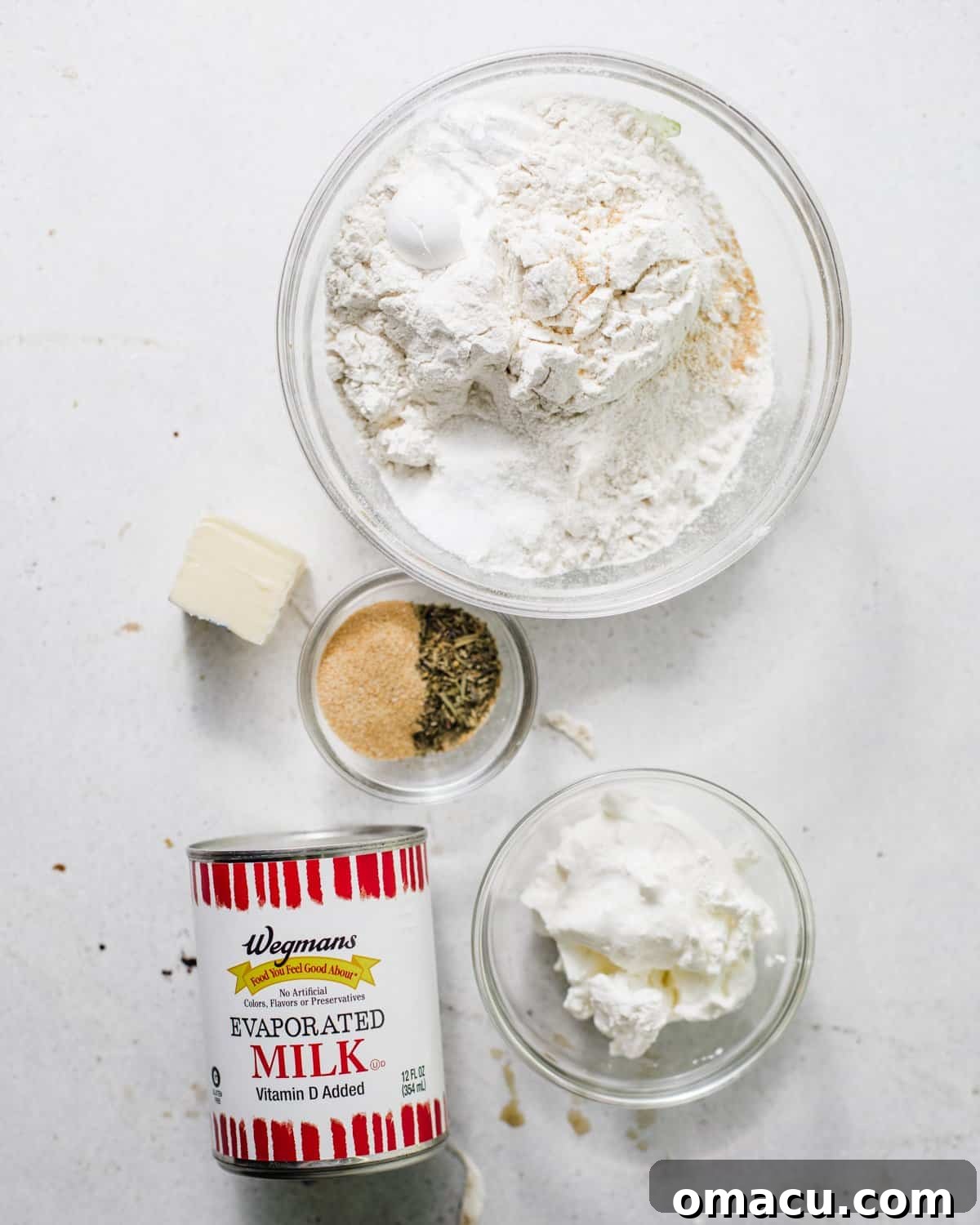 ingredients to make the dumpling dough - flour, seasonings, evaporated milk, butter, and sour cream. 