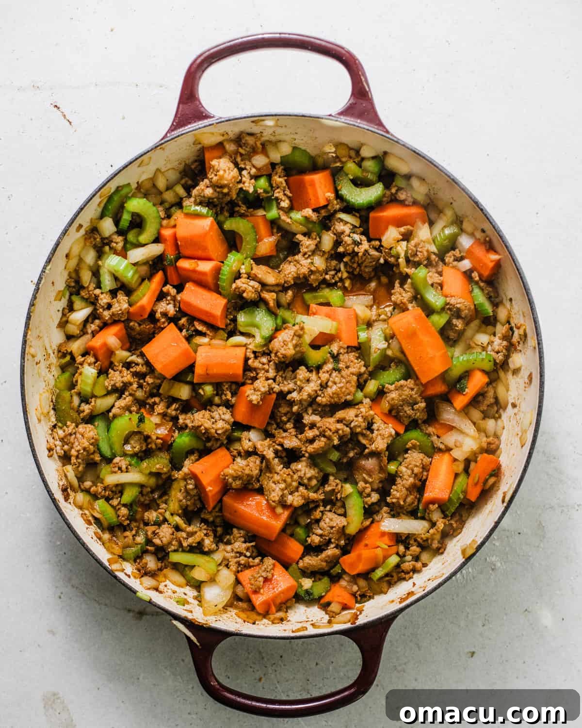 sausage, celery, carrots, onion, seasonings, and garlic in a dutch oven.