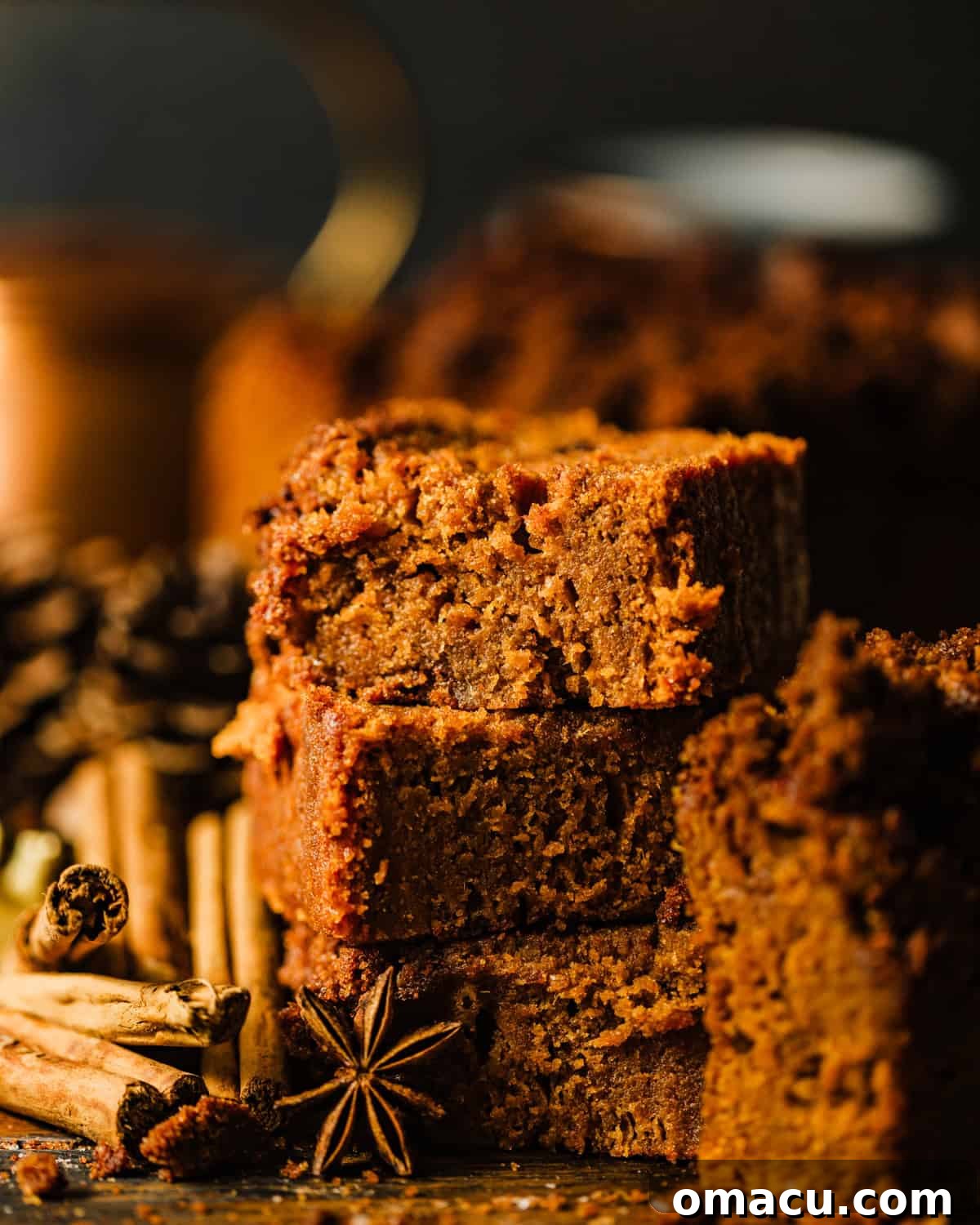 Perfectly sliced sweet potato bread squares, neatly stacked, showcasing the moist interior and delightful streusel topping, ready for serving.