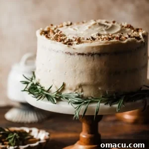 A stunning carrot cake on a cake stand, showcasing its frosted layers.