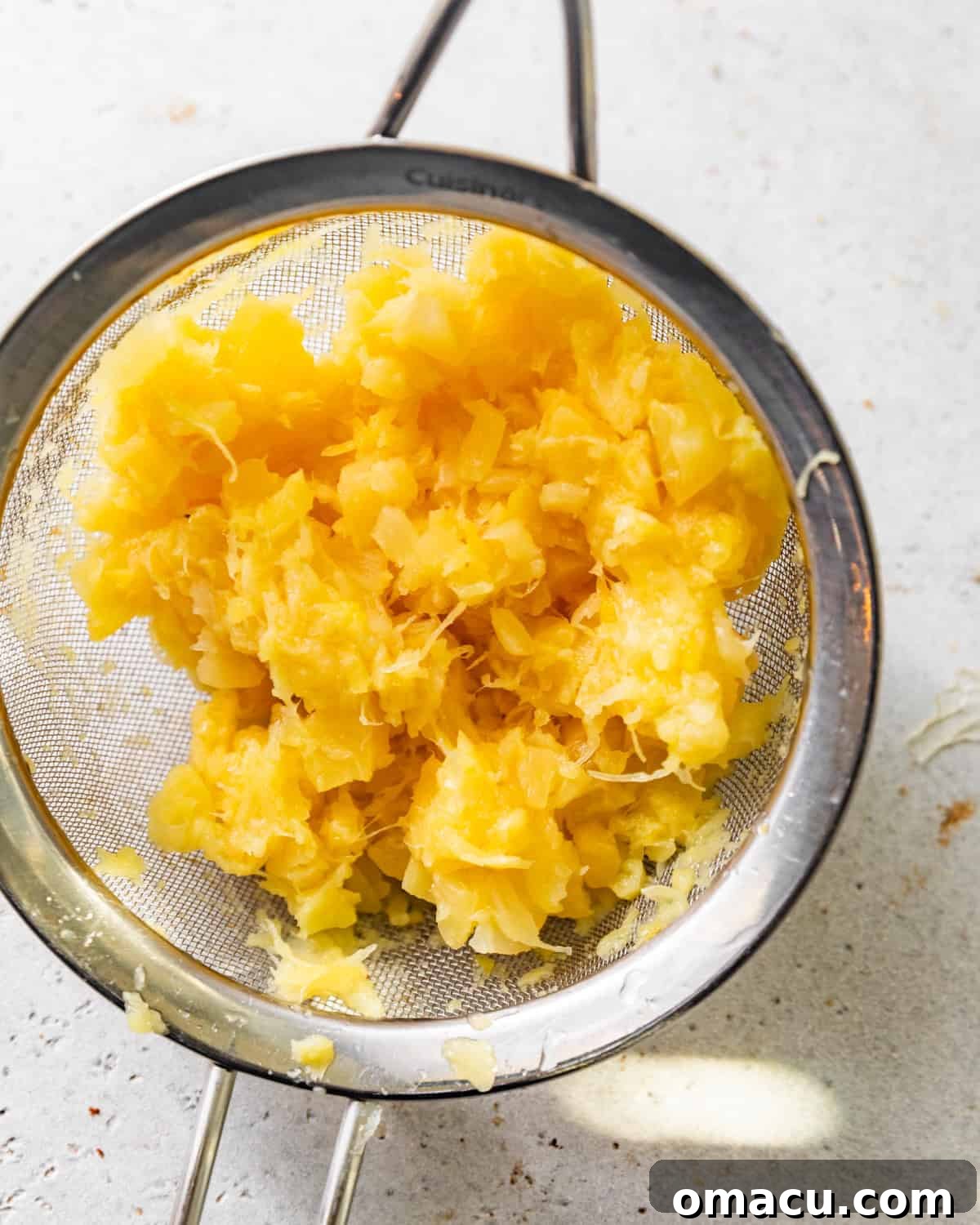 Thoroughly drained crushed pineapples in a fine-mesh strainer, removing all excess liquid.